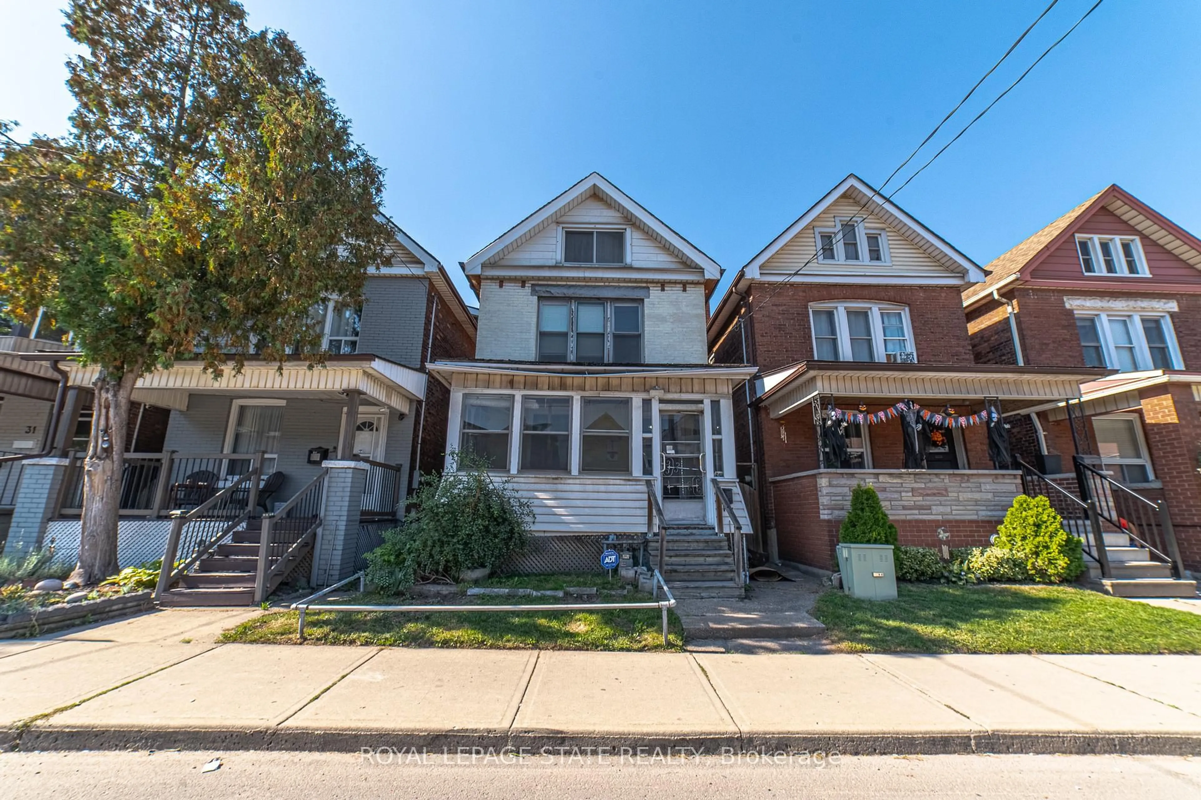 Home with brick exterior material, street for 35 Sherman Ave, Hamilton Ontario L8L 6L9