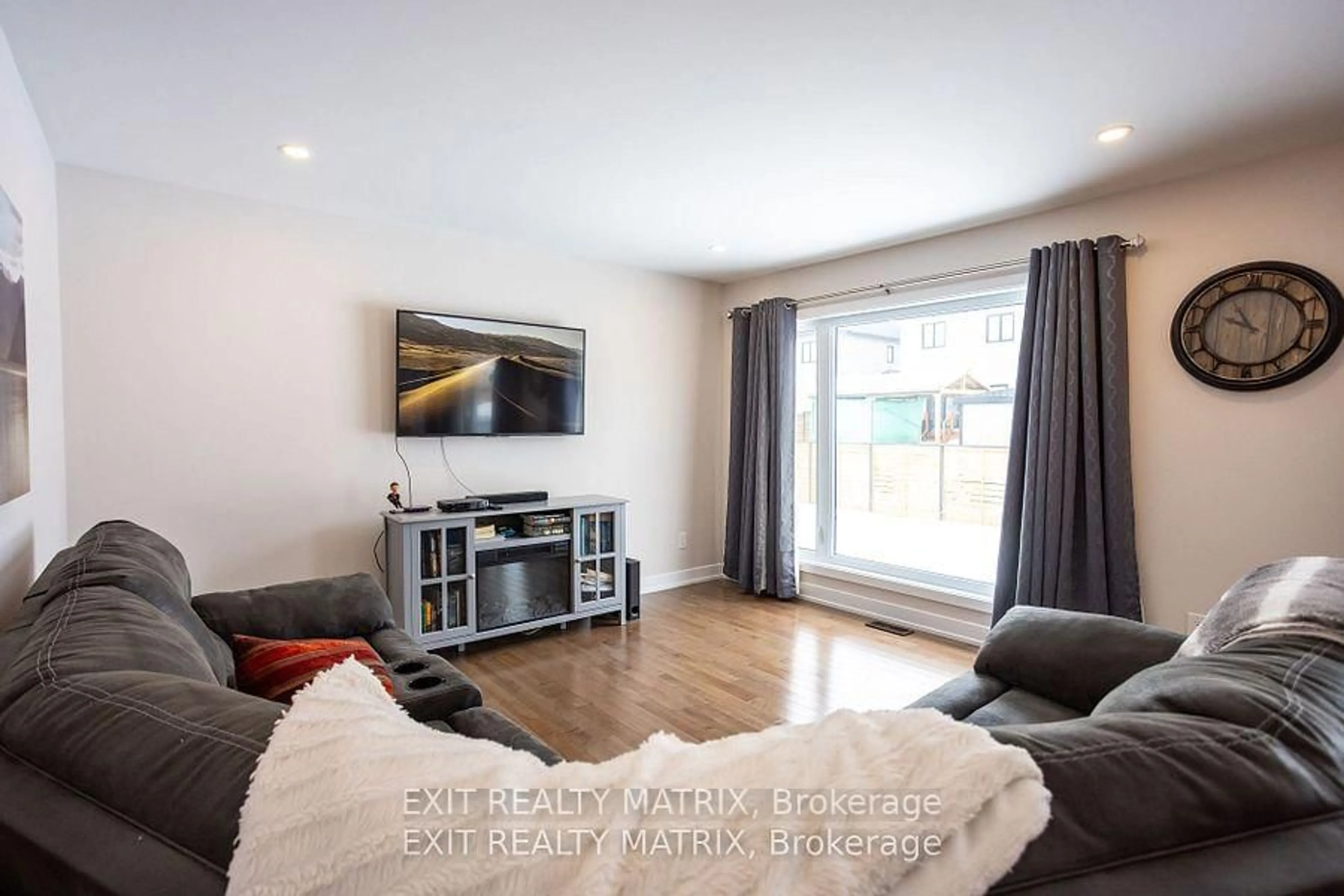 Living room with furniture, wood/laminate floor for 113 Argile St, Casselman Ontario K0A 1M0