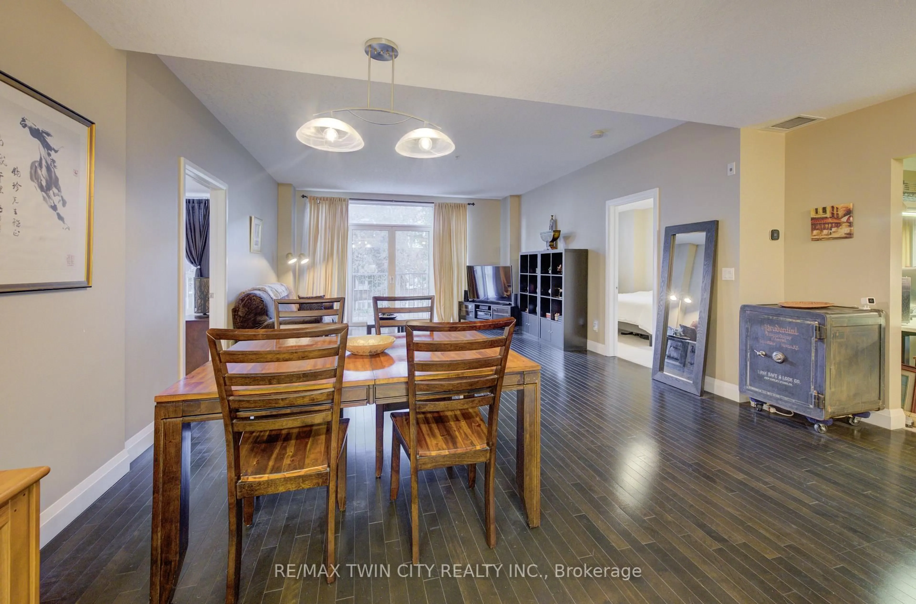 Dining room, wood/laminate floor for 165 Duke St #105, Kitchener Ontario N2H 6T8