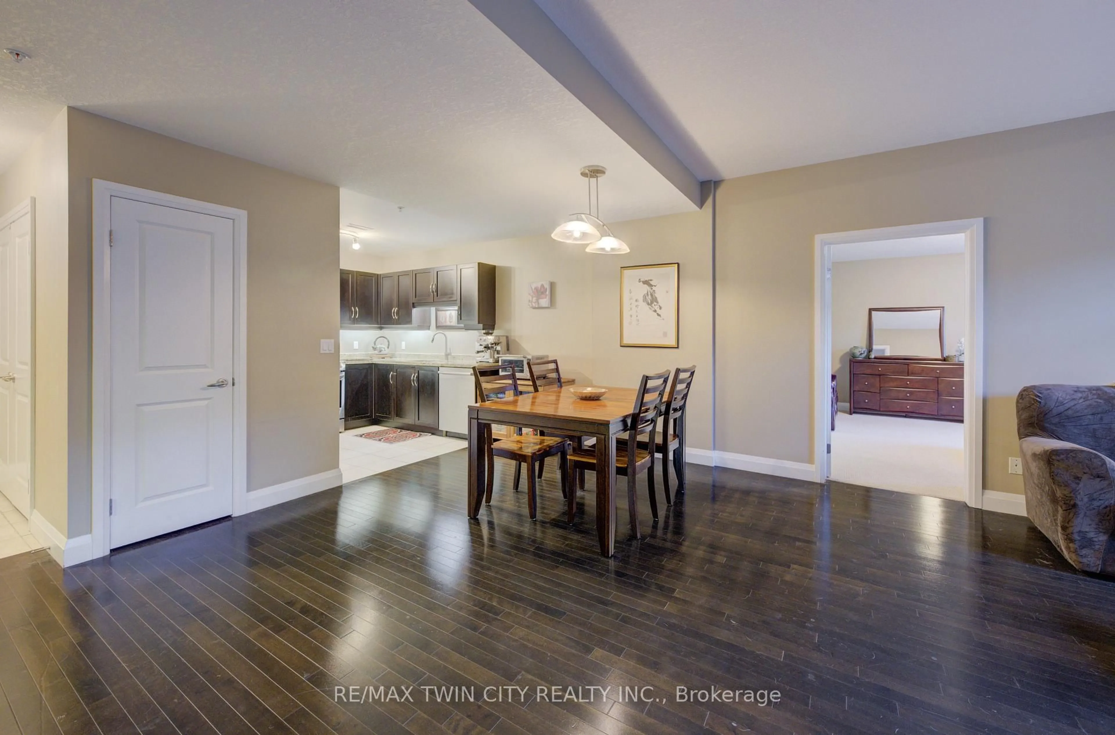 Dining room, wood/laminate floor for 165 Duke St #105, Kitchener Ontario N2H 6T8