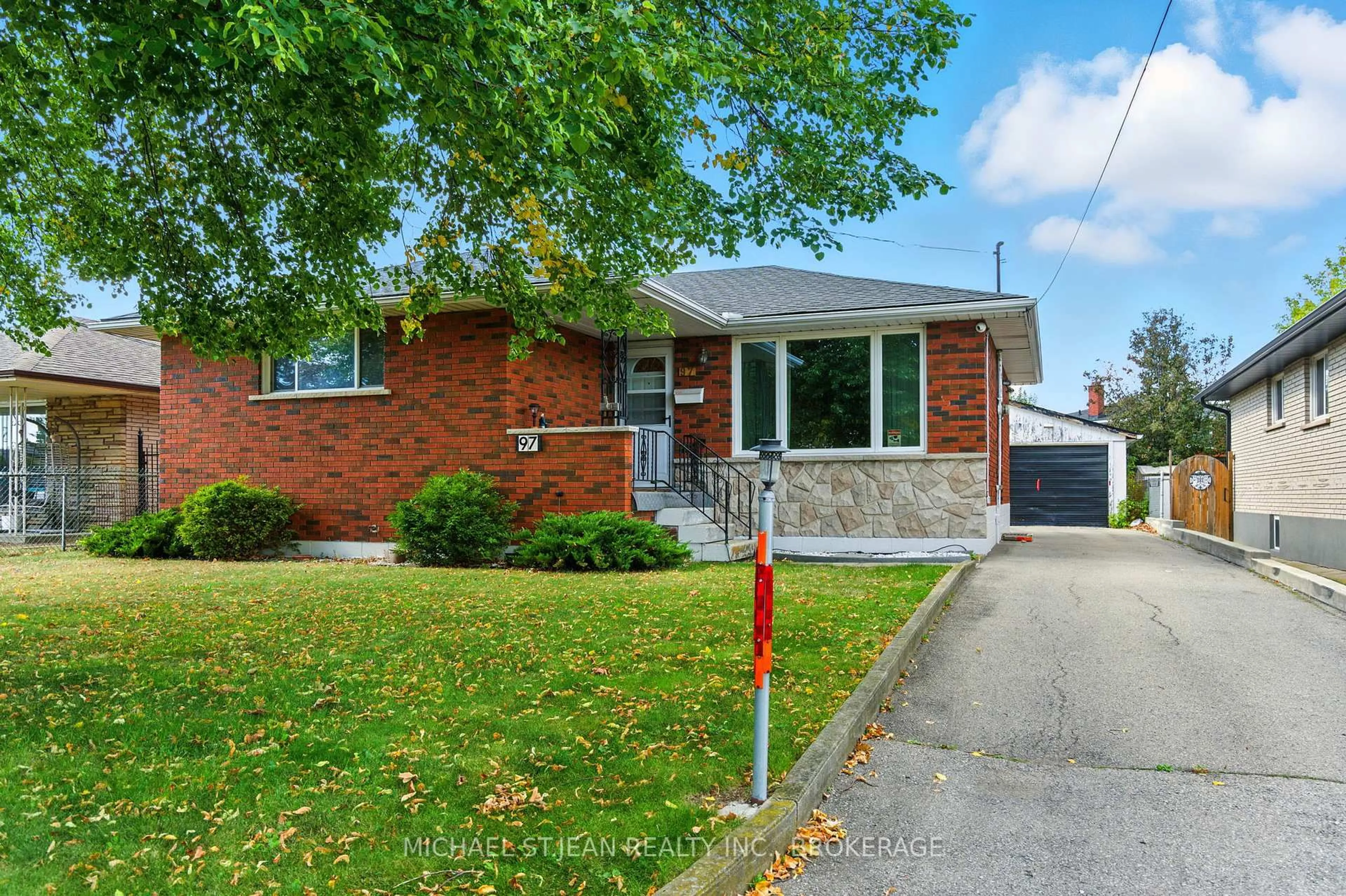Home with brick exterior material, street for 97 Kenora Ave, Hamilton Ontario L8E 1C3