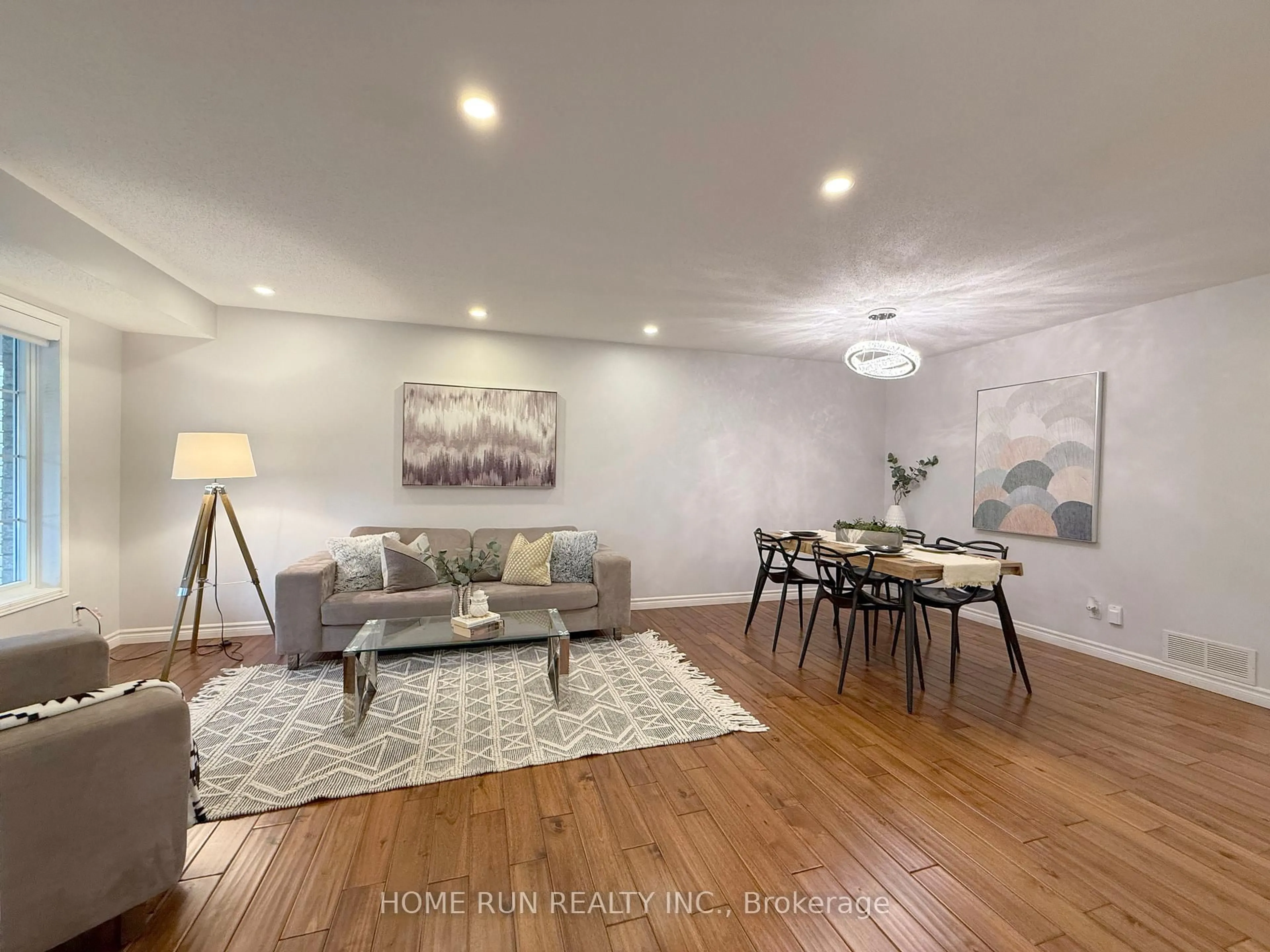 Living room with furniture, wood/laminate floor for 49 Deerfox Dr, Ottawa Ontario K2J 4V1