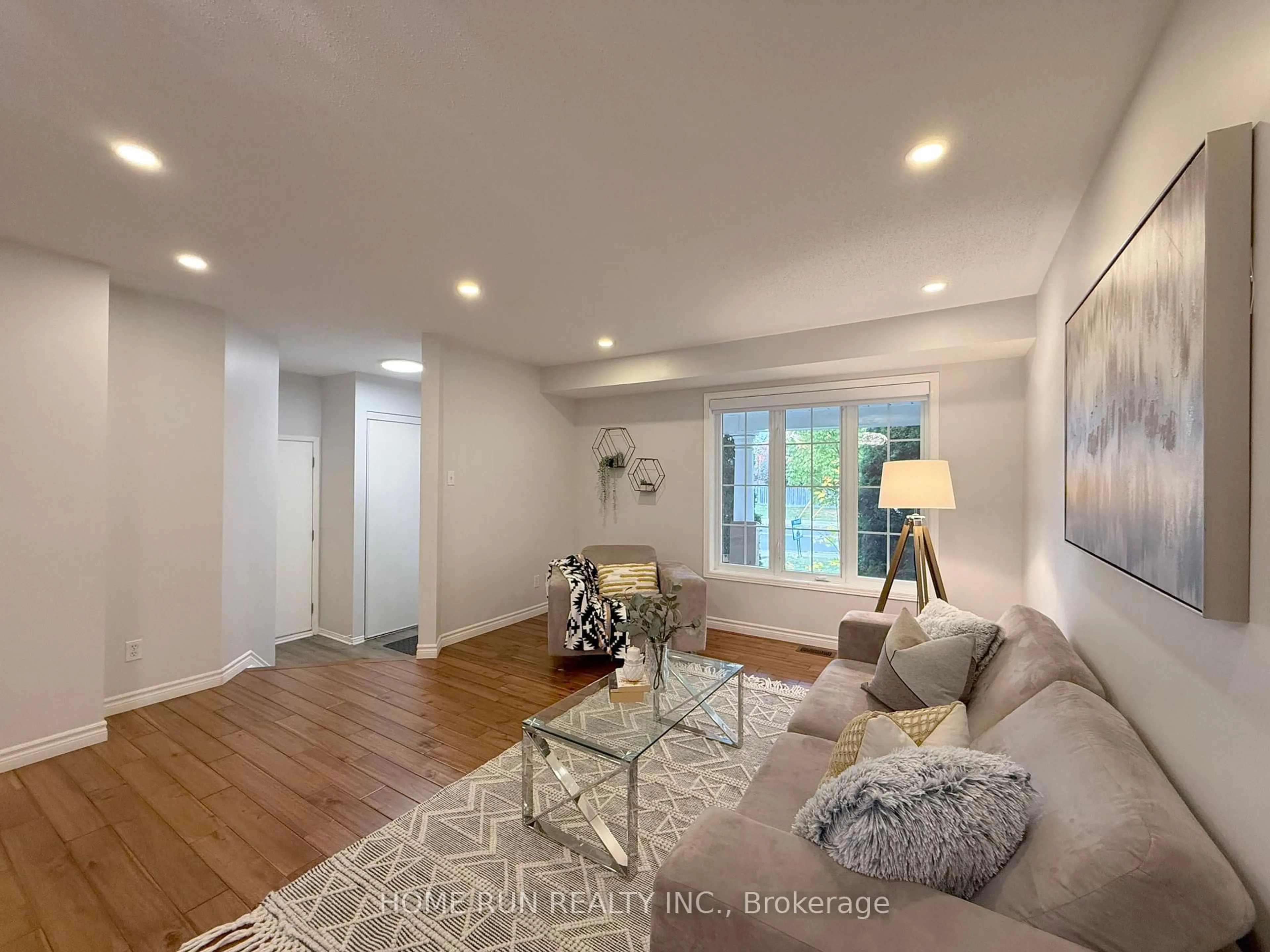 Living room with furniture, wood/laminate floor for 49 Deerfox Dr, Ottawa Ontario K2J 4V1
