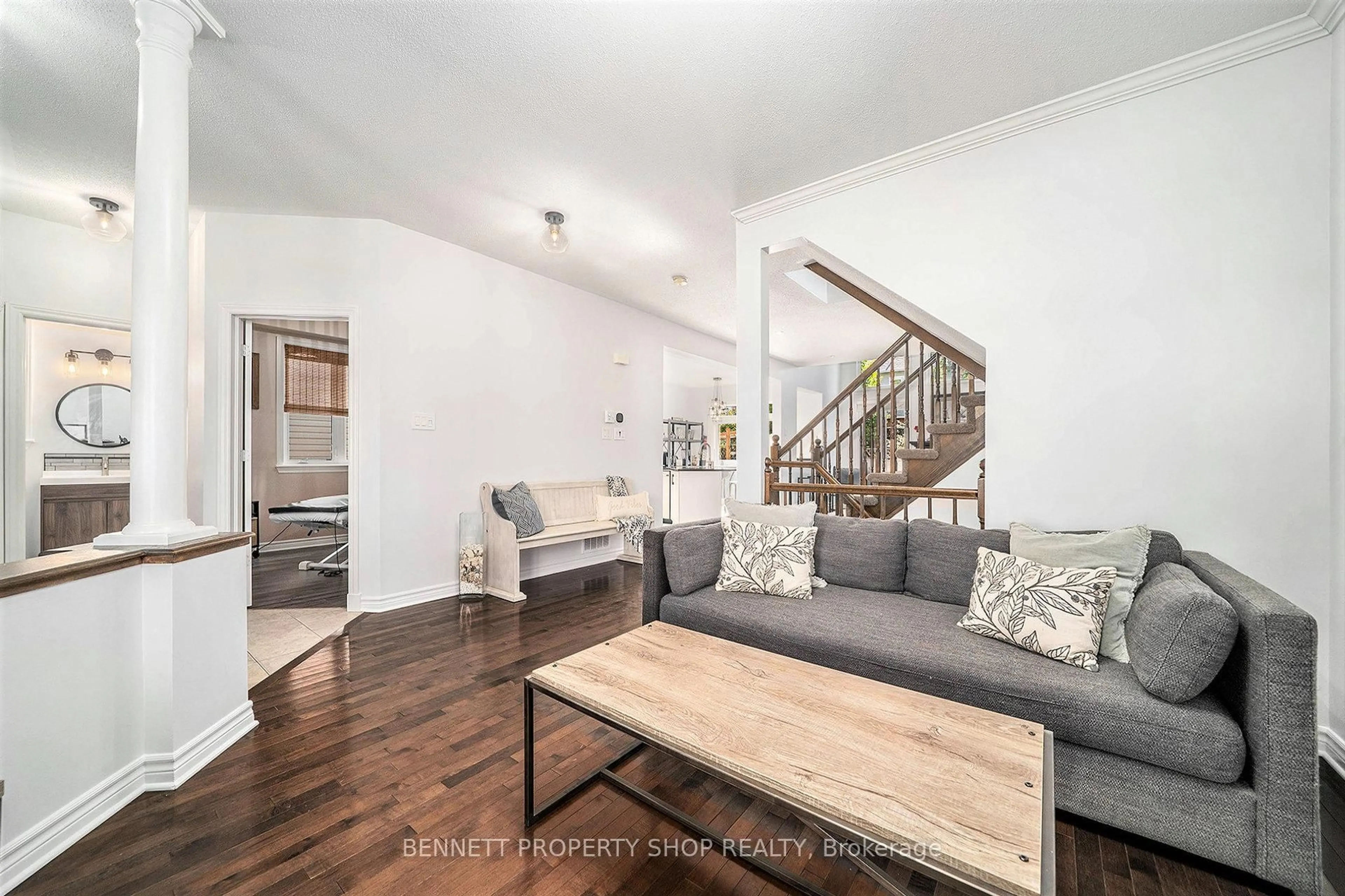 Living room with furniture, wood/laminate floor for 167 Portrush Ave, Ottawa Ontario K2J 5J4