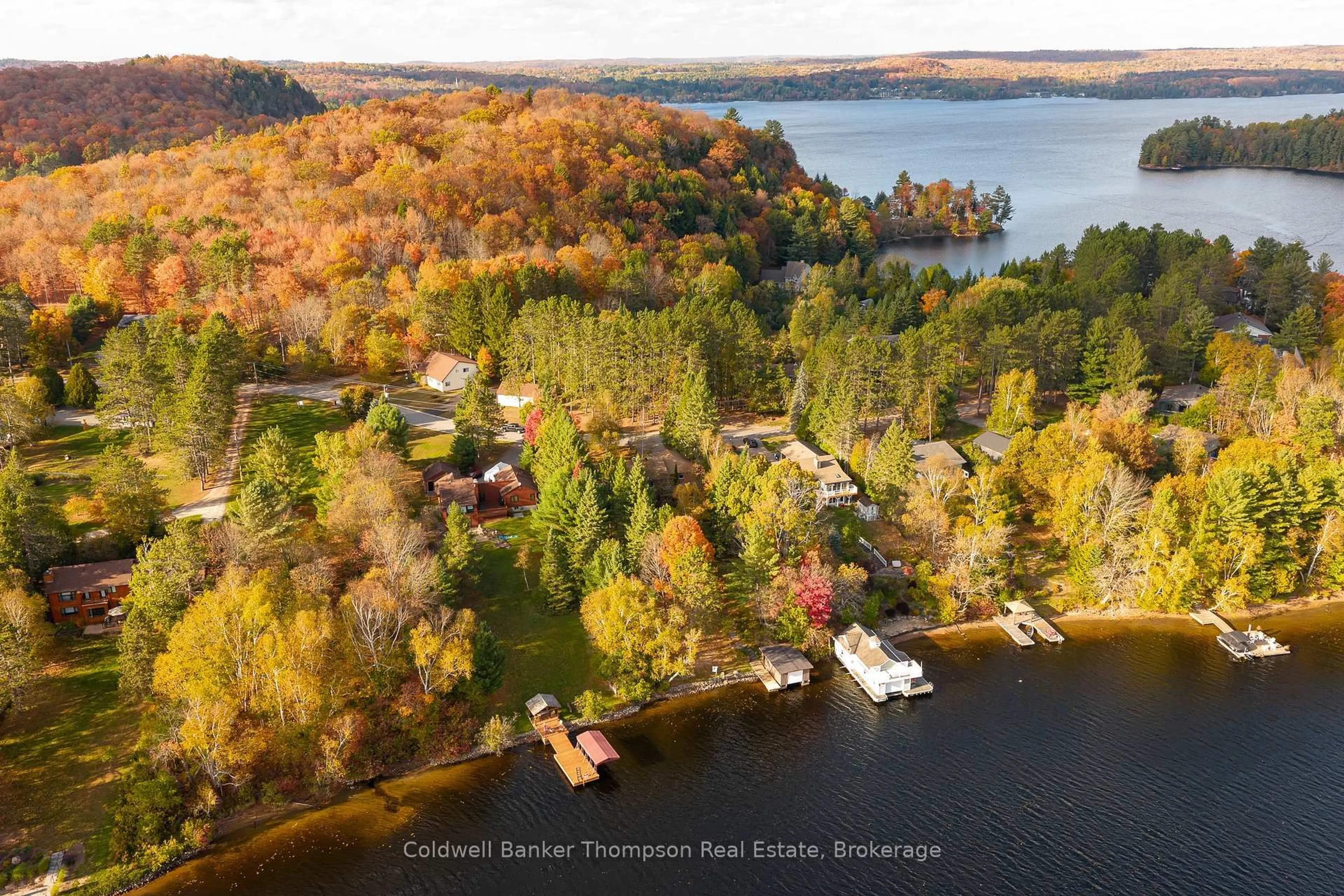 A pic from outside/outdoor area/front of a property/back of a property/a pic from drone, water/lake/river/ocean view for 281 Echo Bay Rd, Huntsville Ontario P1H 1R4