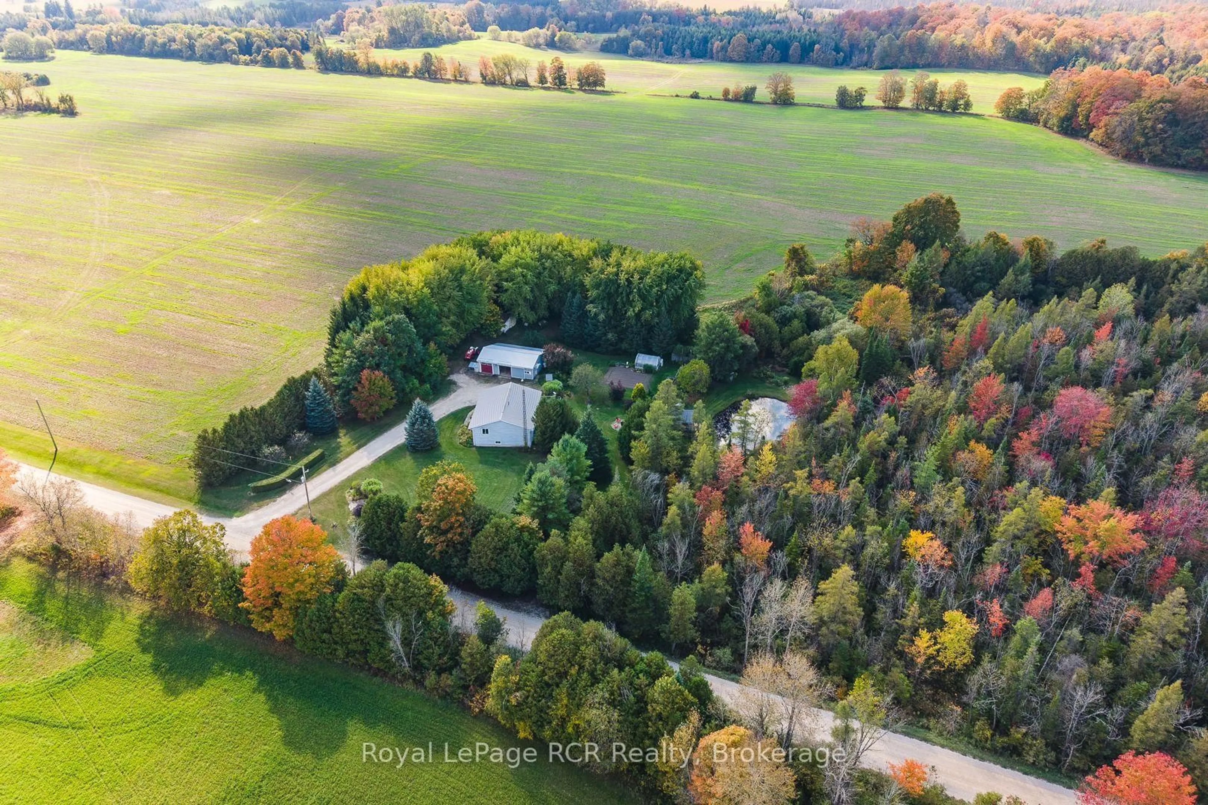 A pic from outside/outdoor area/front of a property/back of a property/a pic from drone, forest/trees view for 74074 10 Sdrd, West Grey Ontario N0G 1S0