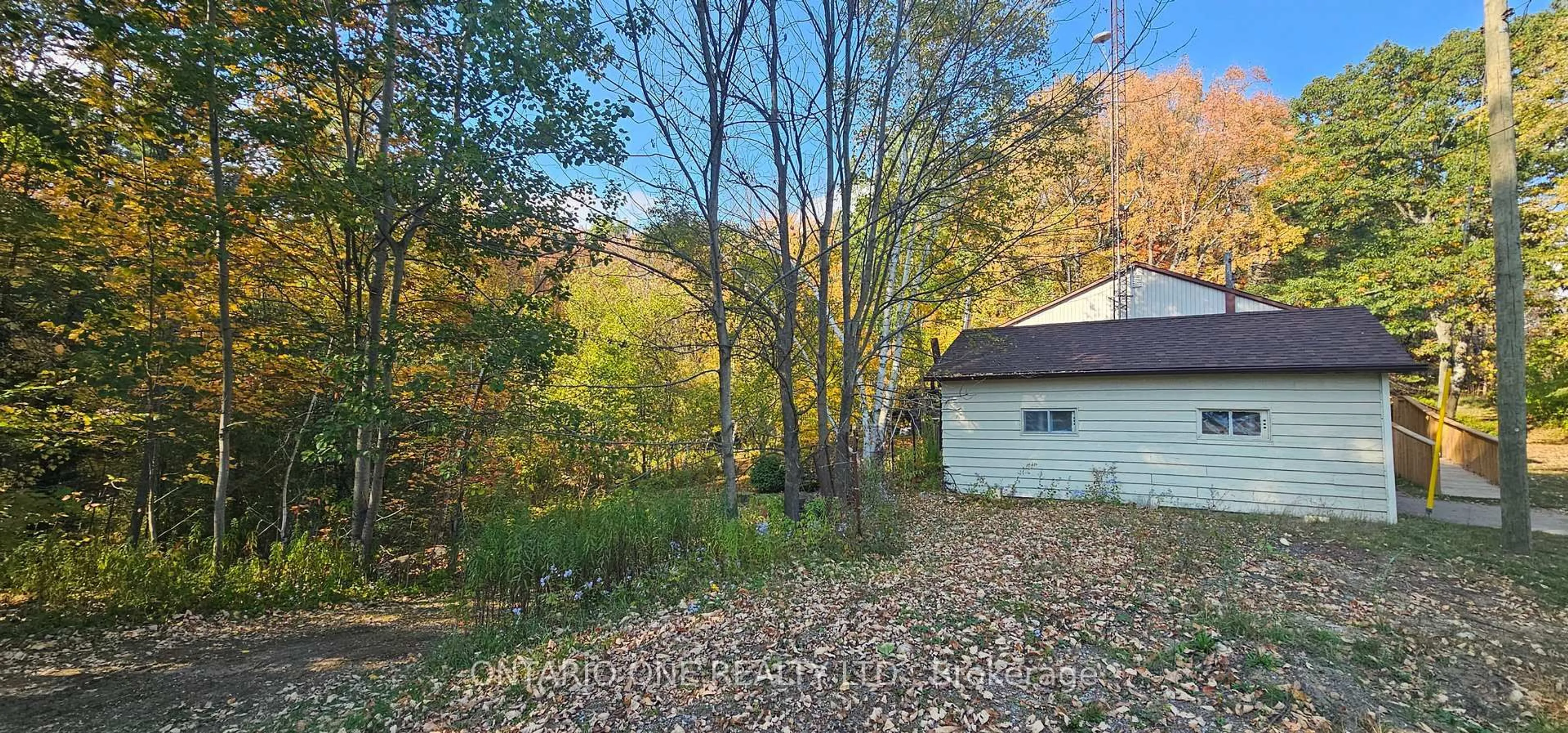 A pic from outside/outdoor area/front of a property/back of a property/a pic from drone, forest/trees view for 1479 11 Highway, Gravenhurst Ontario P0E 1G0