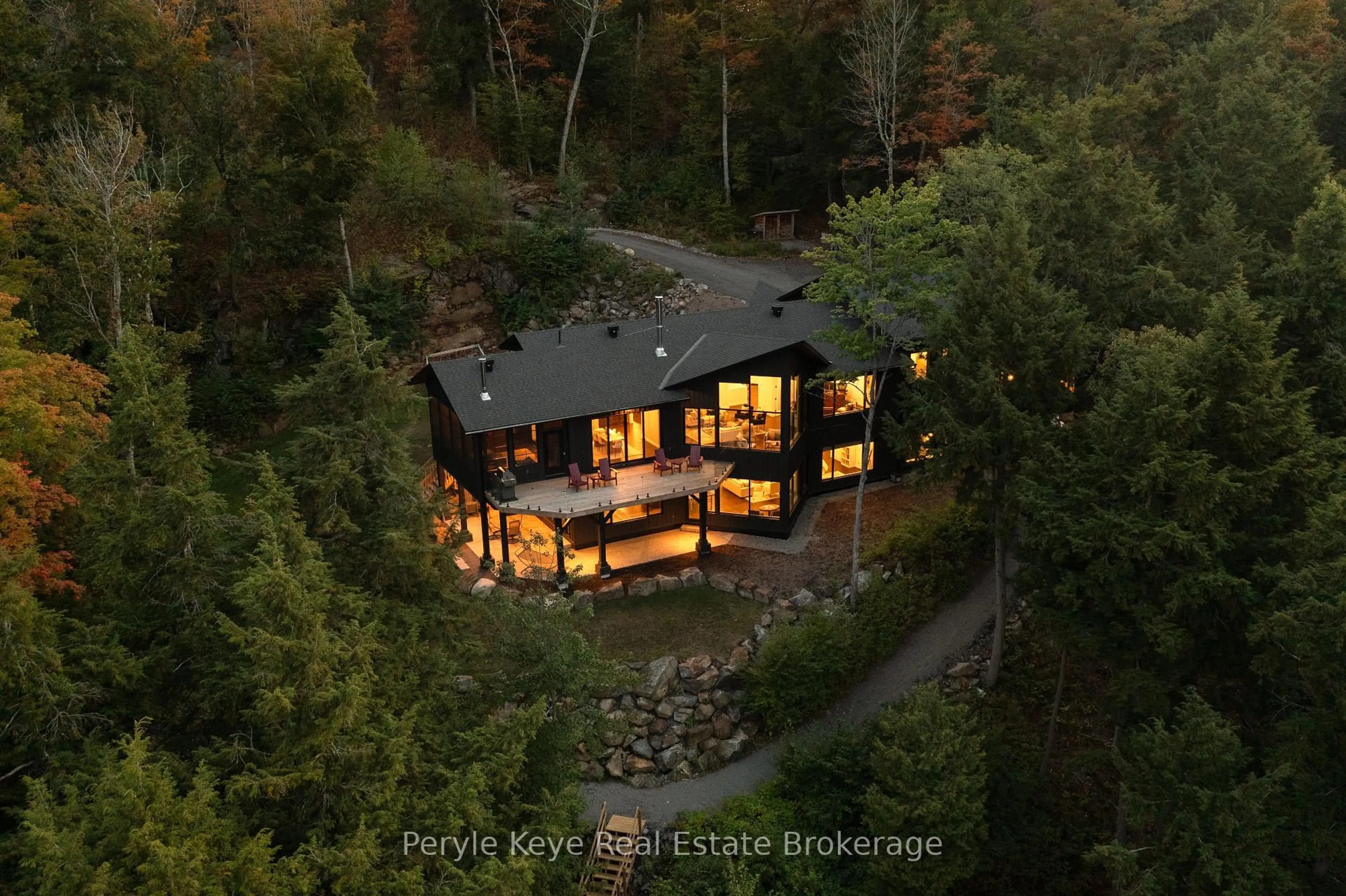 A pic from outside/outdoor area/front of a property/back of a property/a pic from drone, forest/trees view for 86 Claren Cres, Huntsville Ontario P1H 0C3