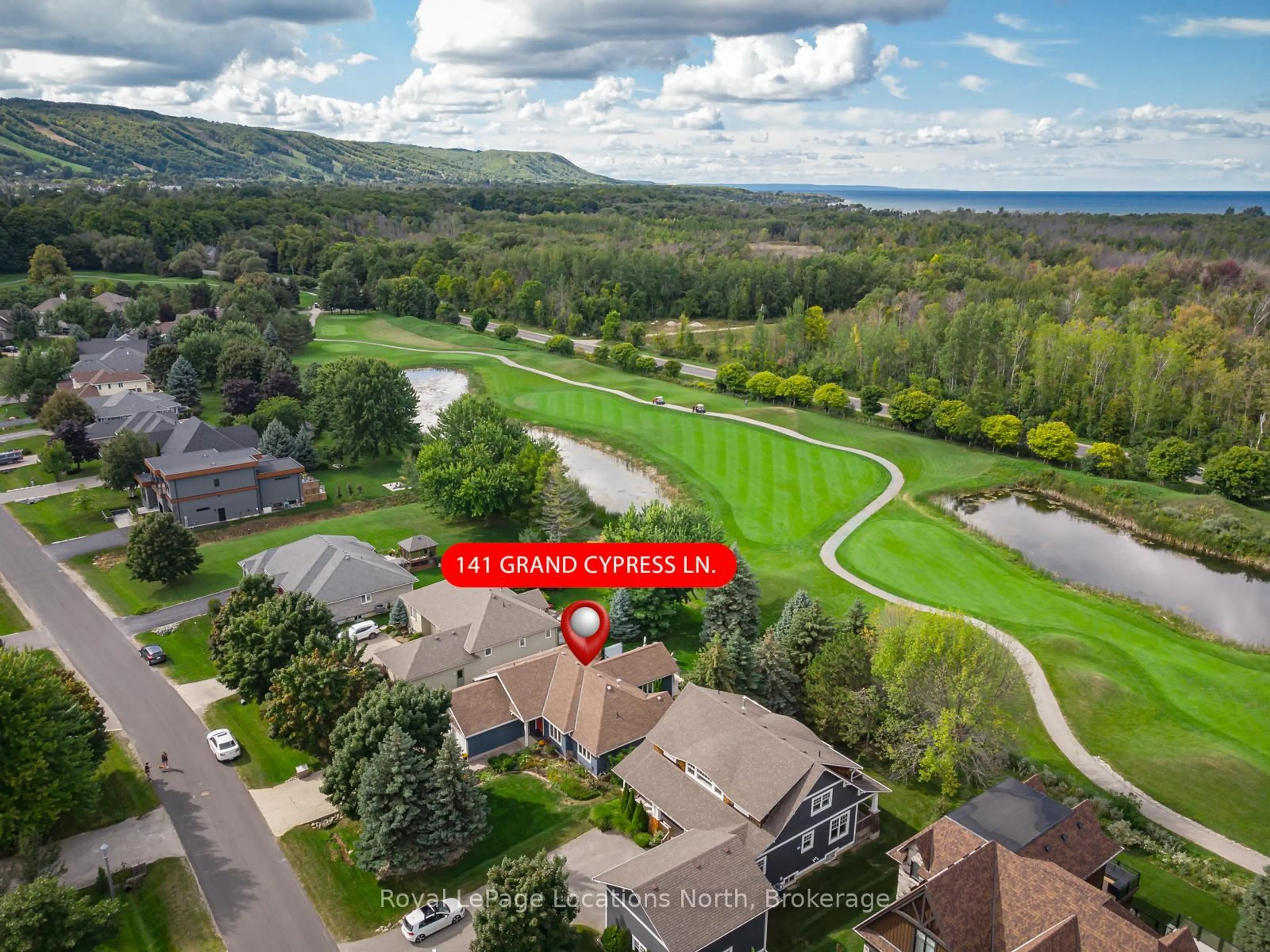 A pic from outside/outdoor area/front of a property/back of a property/a pic from drone, water/lake/river/ocean view for 141 Grand Cypress Lane, Blue Mountains Ontario L9Y 0K7