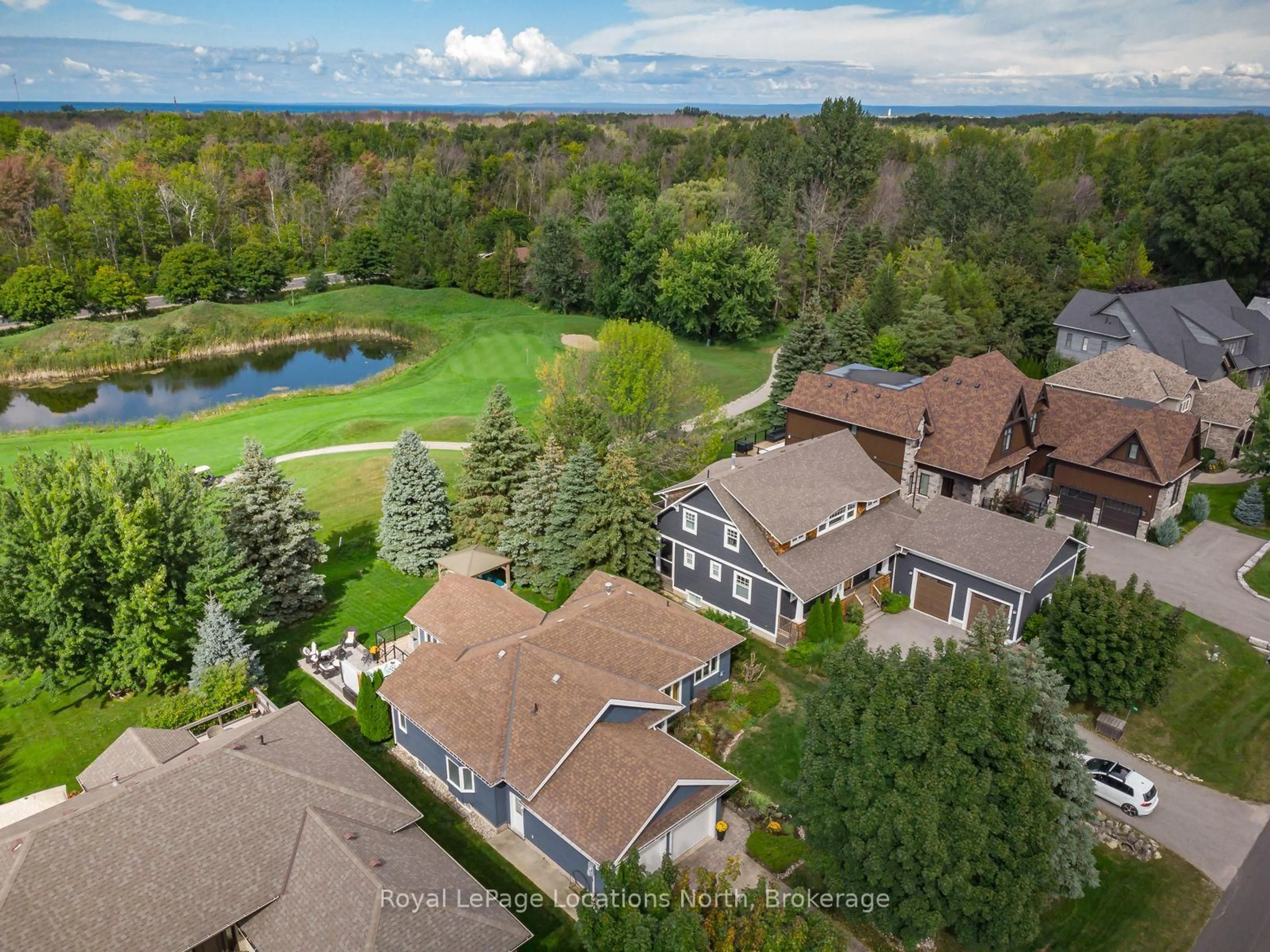 A pic from outside/outdoor area/front of a property/back of a property/a pic from drone, water/lake/river/ocean view for 141 Grand Cypress Lane, Blue Mountains Ontario L9Y 0K7