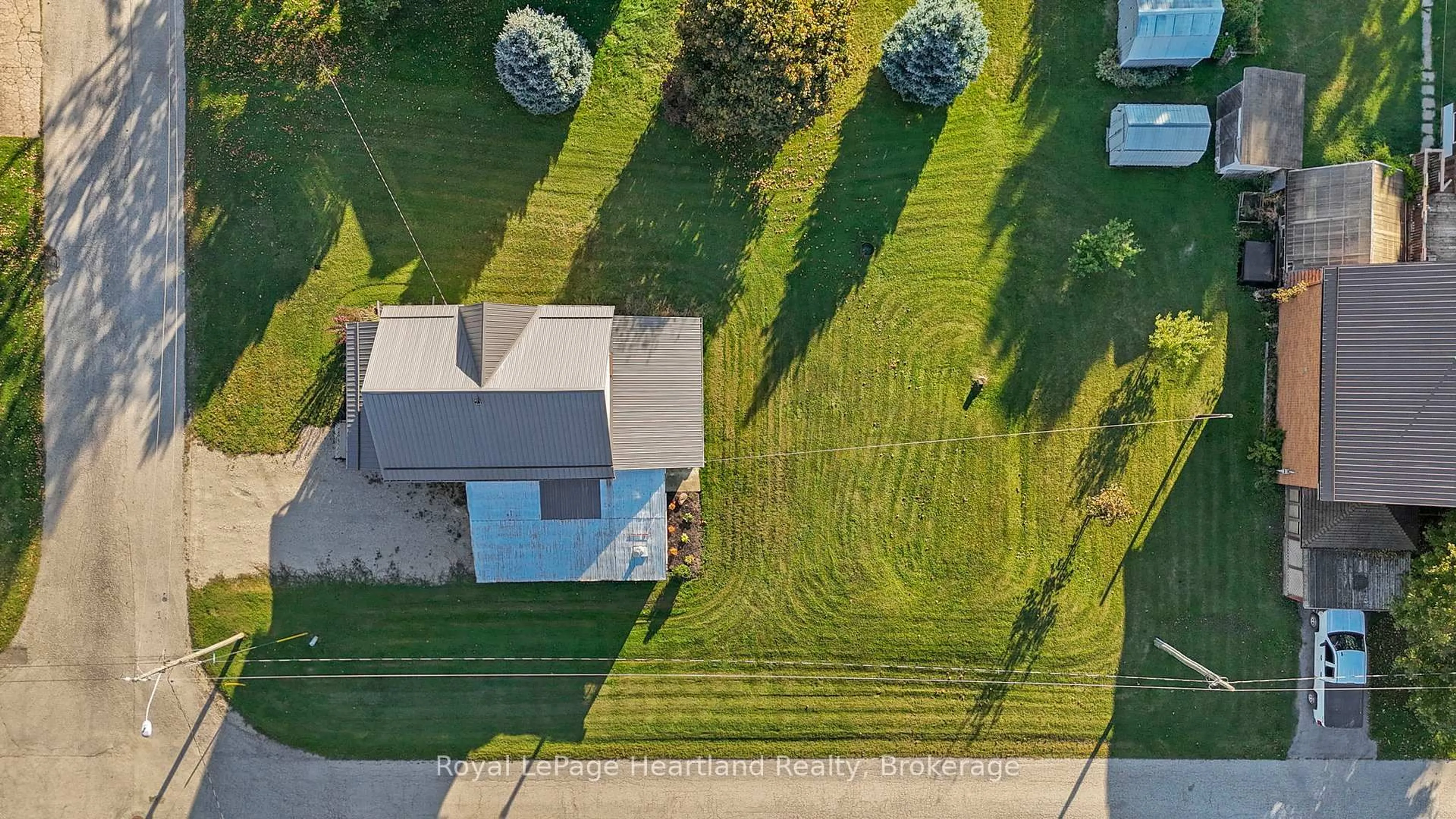 A pic from outside/outdoor area/front of a property/back of a property/a pic from drone, street for 15 QUEEN St, Minto Ontario N0G 1M0