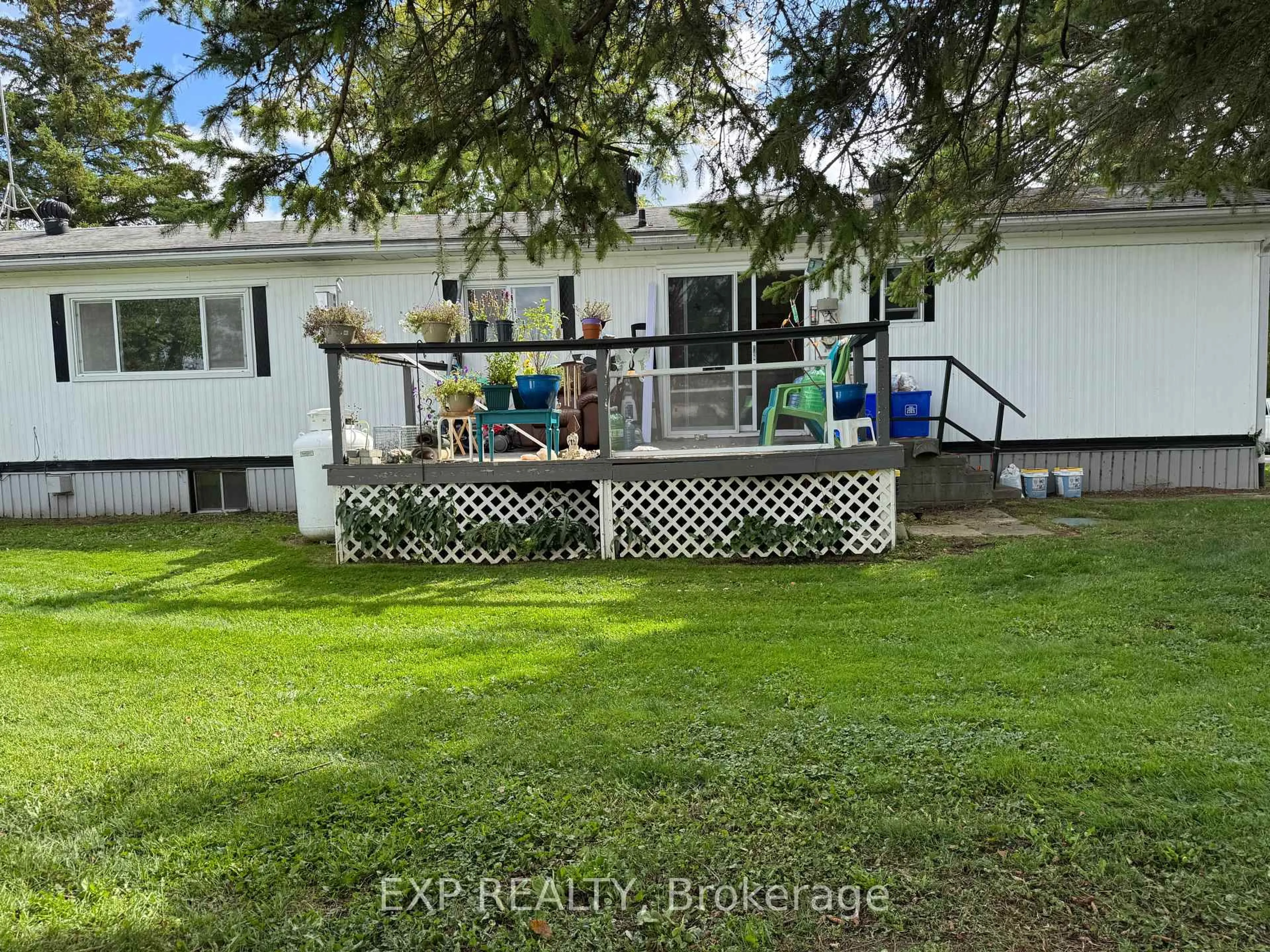 A pic from outside/outdoor area/front of a property/back of a property/a pic from drone, water/lake/river/ocean view for 15 Park Cres, Kawartha Lakes Ontario K9V 4R1