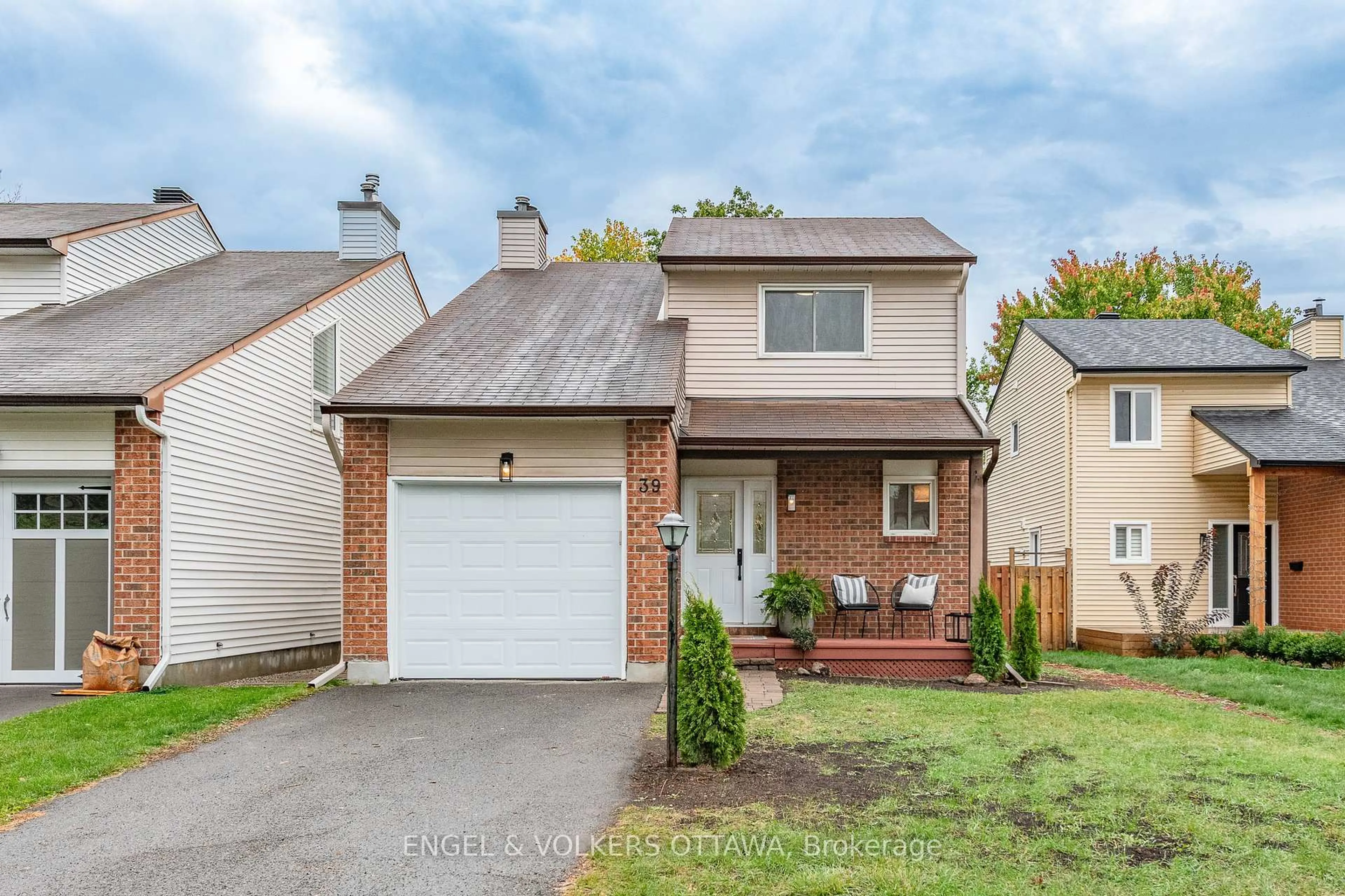 Home with vinyl exterior material, street for 39 Benlark Rd, Barrhaven Ontario K2J 2L5