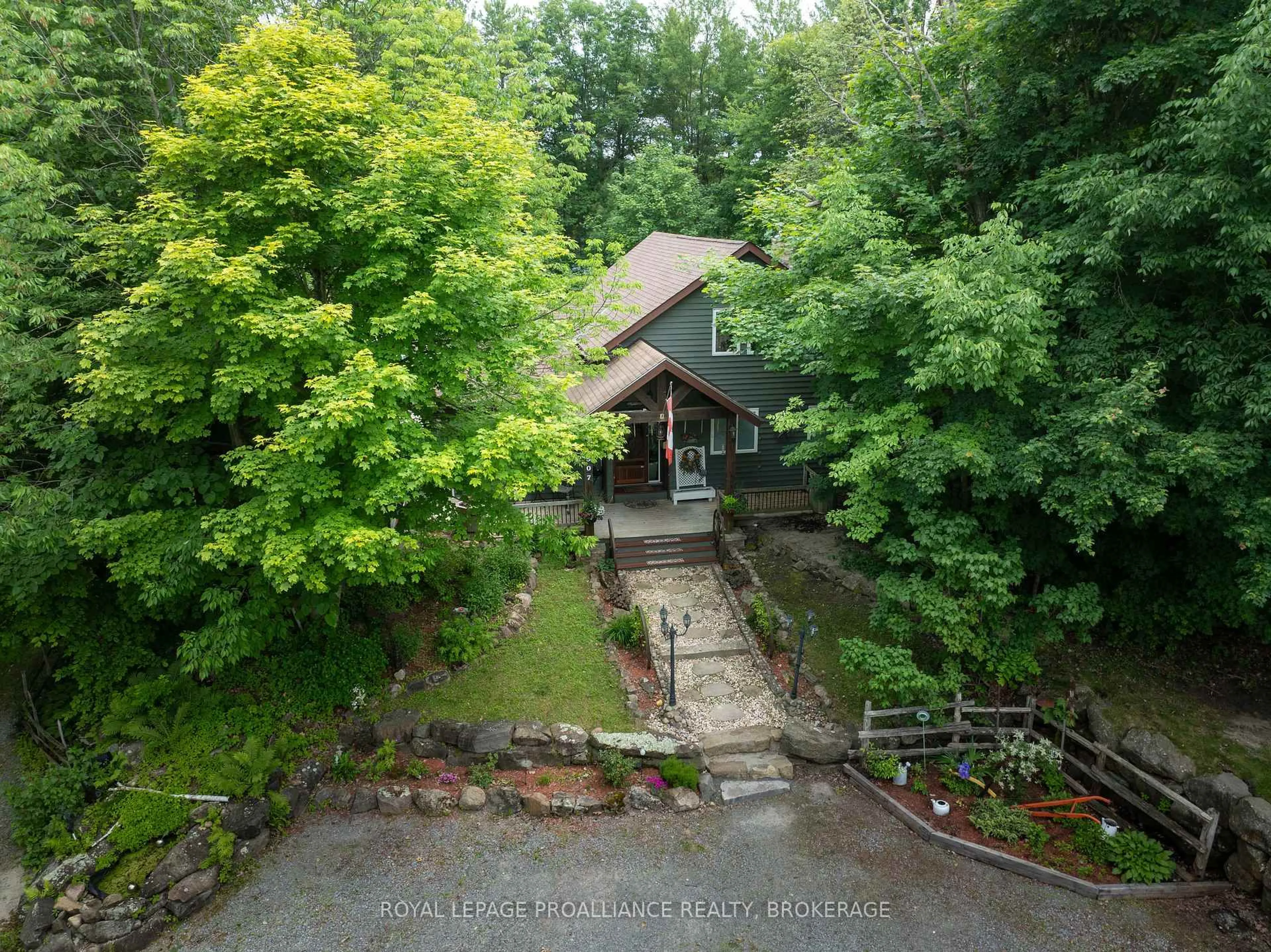 A pic from outside/outdoor area/front of a property/back of a property/a pic from drone, forest/trees view for 507 Frye Lane, Perth Road Ontario K0H 2L0