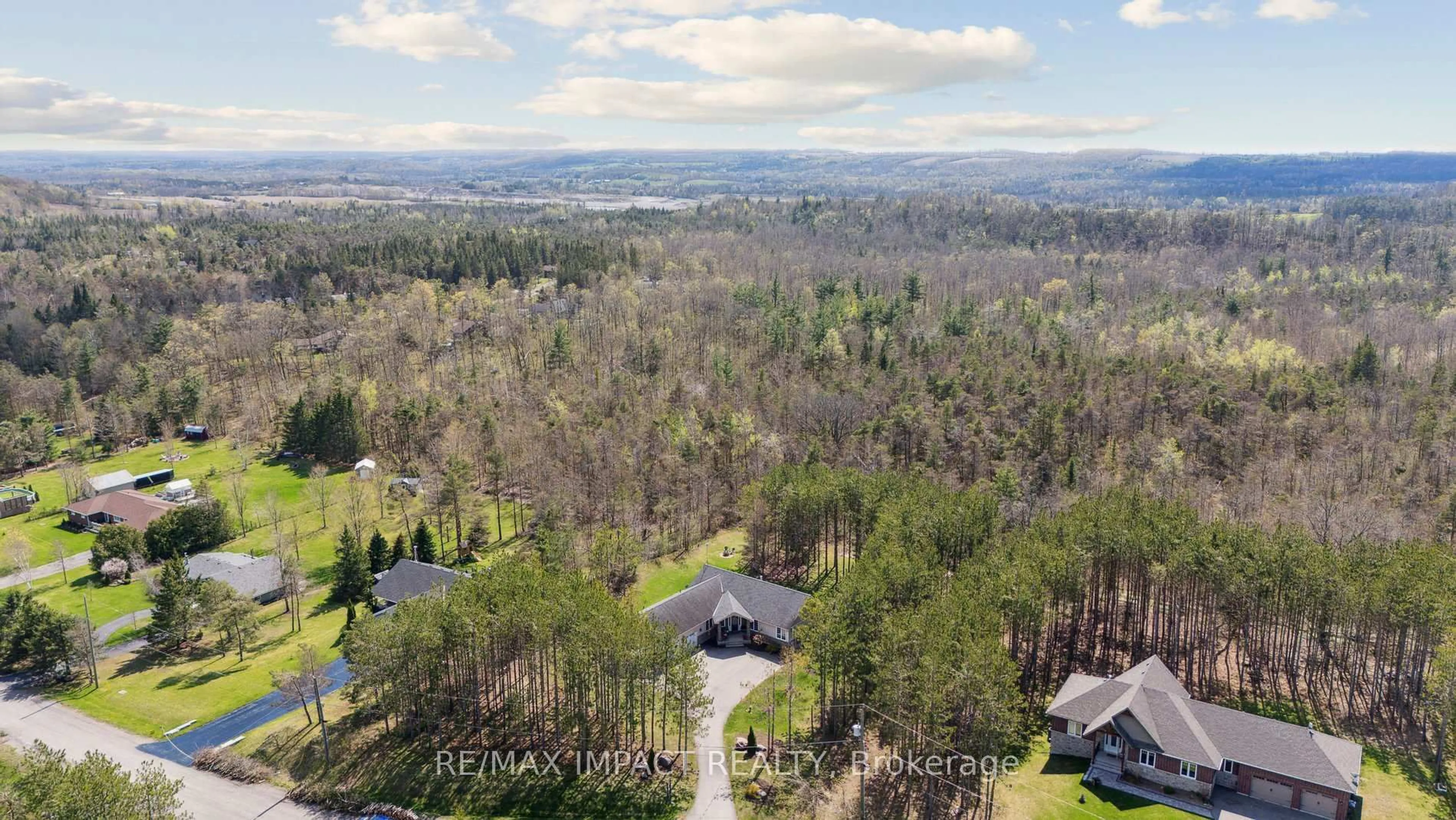A pic from outside/outdoor area/front of a property/back of a property/a pic from drone, forest/trees view for 27 Slalom Dr, Kawartha Lakes Ontario L0A 1A0
