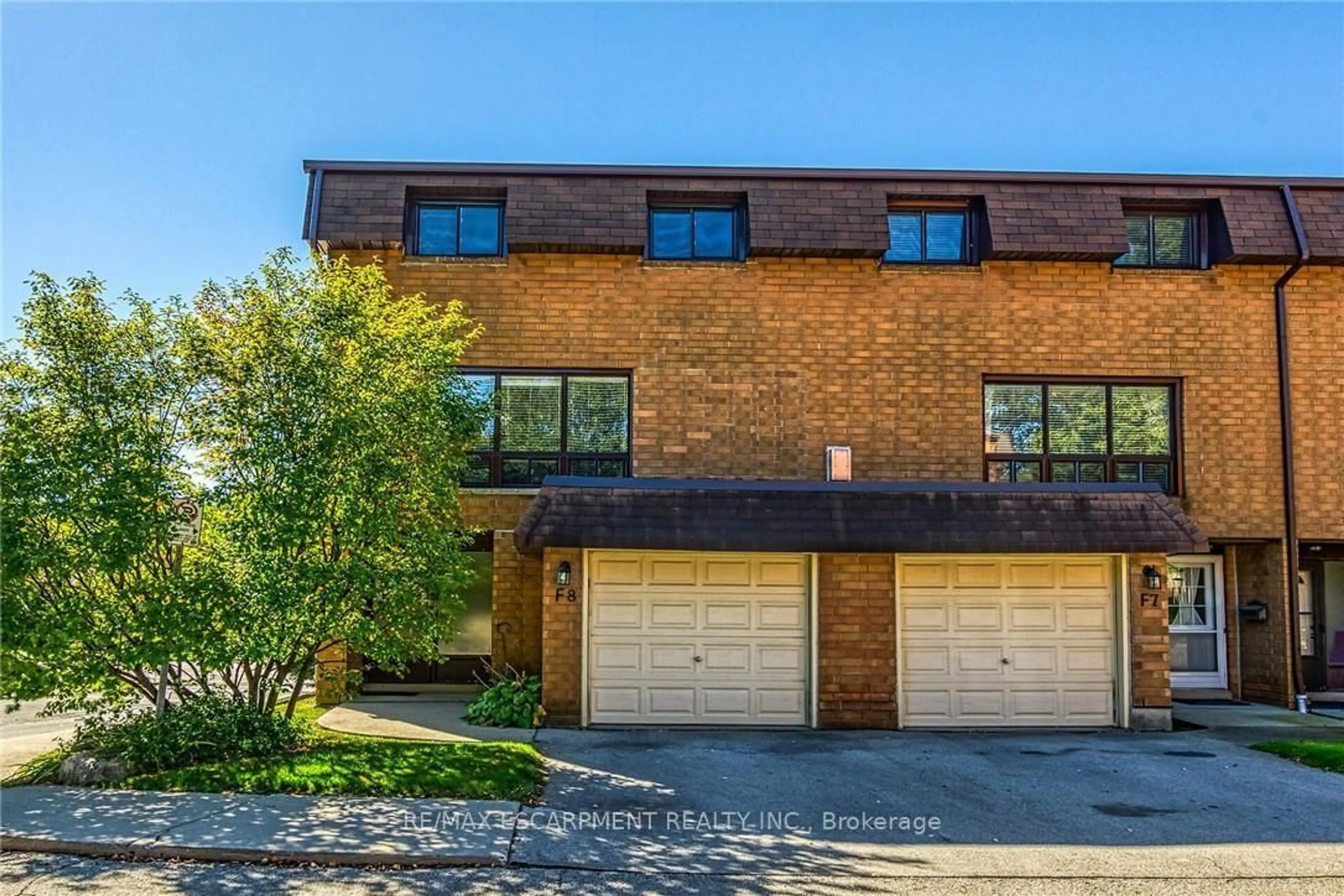 Home with brick exterior material, street for 500 STONE CHURCH Rd #F8, Hamilton Ontario L9B 1R2
