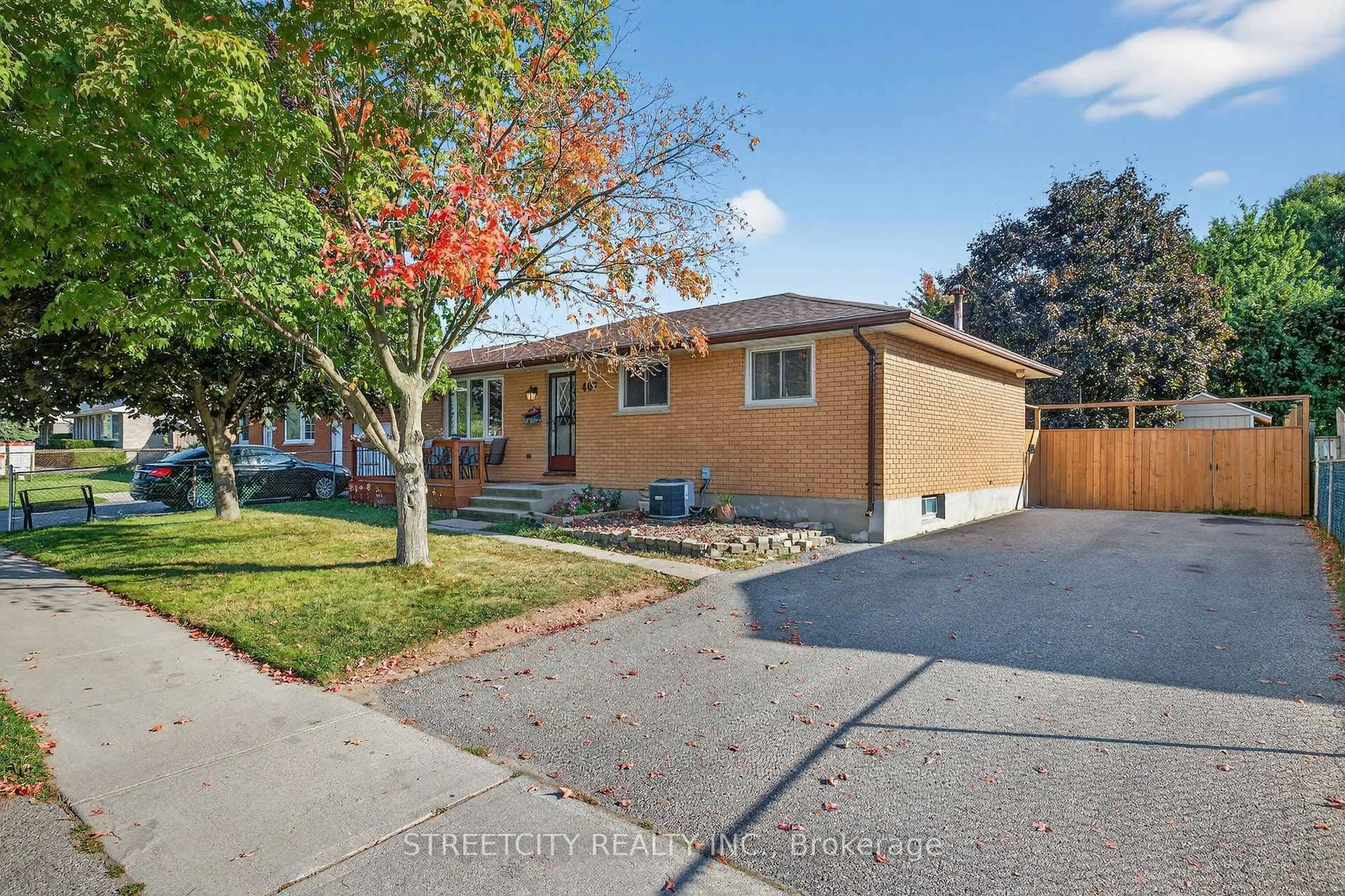 Home with brick exterior material, street for 407 Elm St, St. Thomas Ontario N5R 1K2