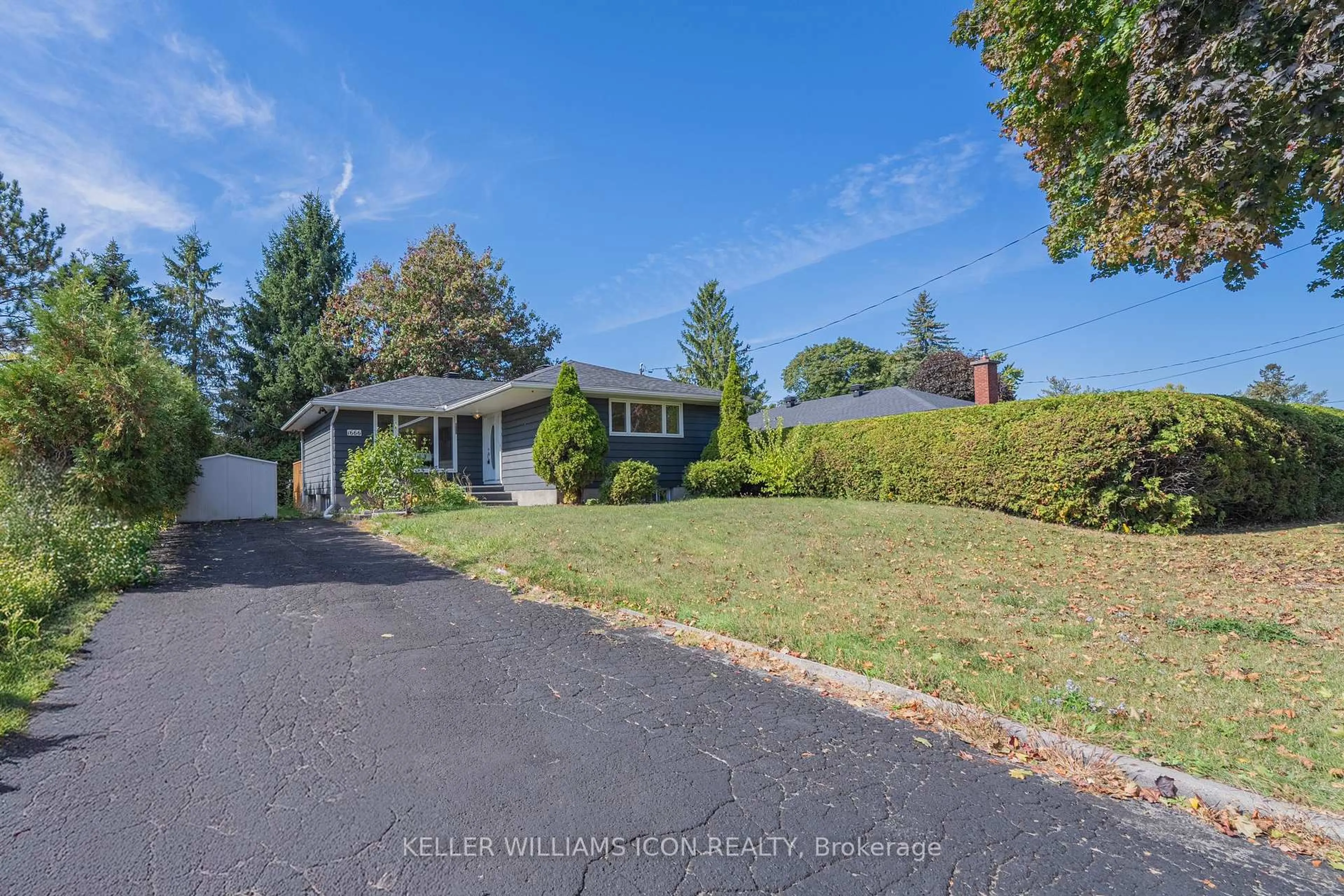 A pic from outside/outdoor area/front of a property/back of a property/a pic from drone, street for 1666 Fisher Ave, Ottawa Ontario K2C 1X7