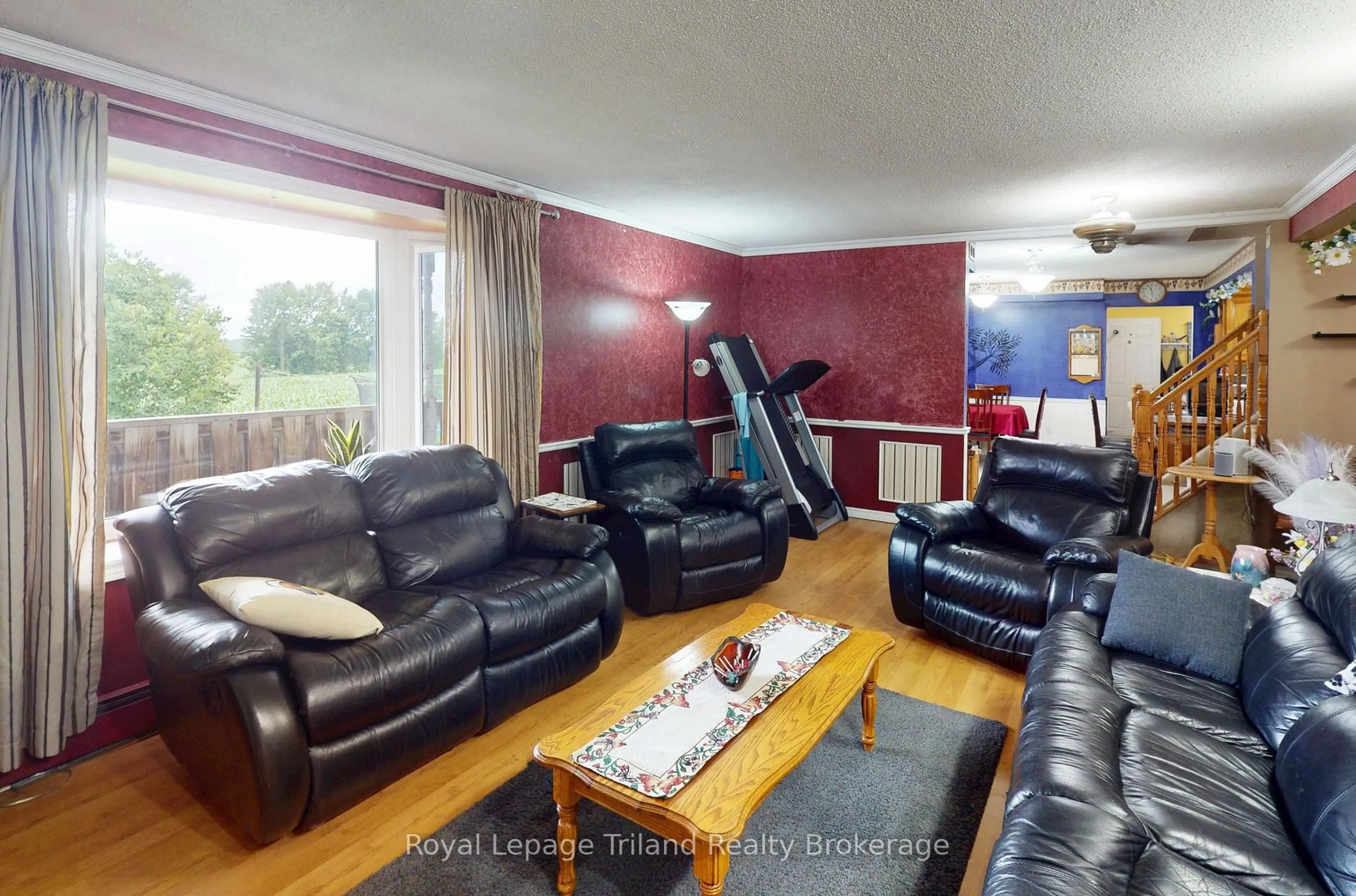 Living room with furniture, wood/laminate floor for 714653 Middletown Line, Norwich Ontario N4S 7W3