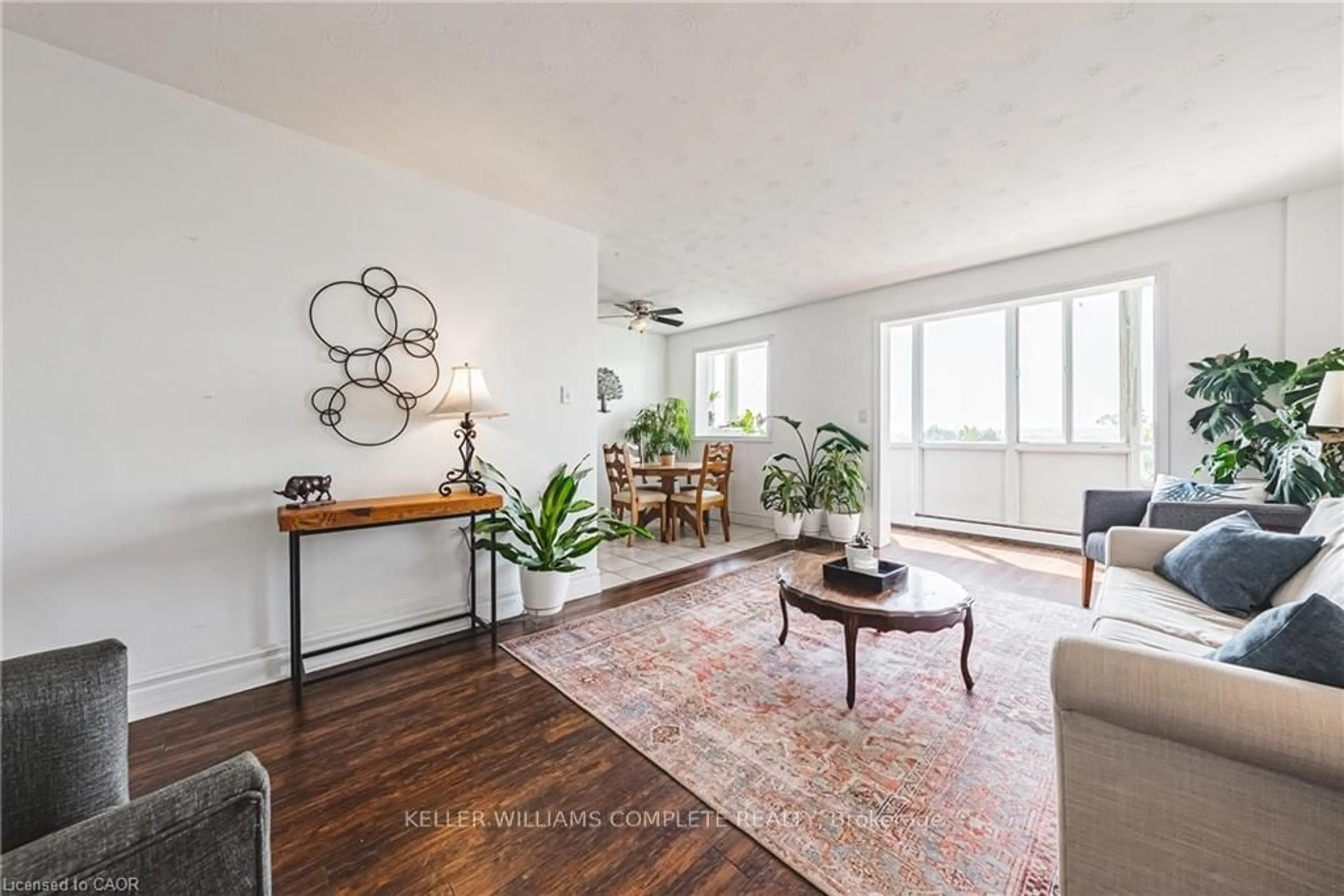 Living room with furniture, wood/laminate floor for 101 QUEEN St #606, Hamilton Ontario L8P 3R9