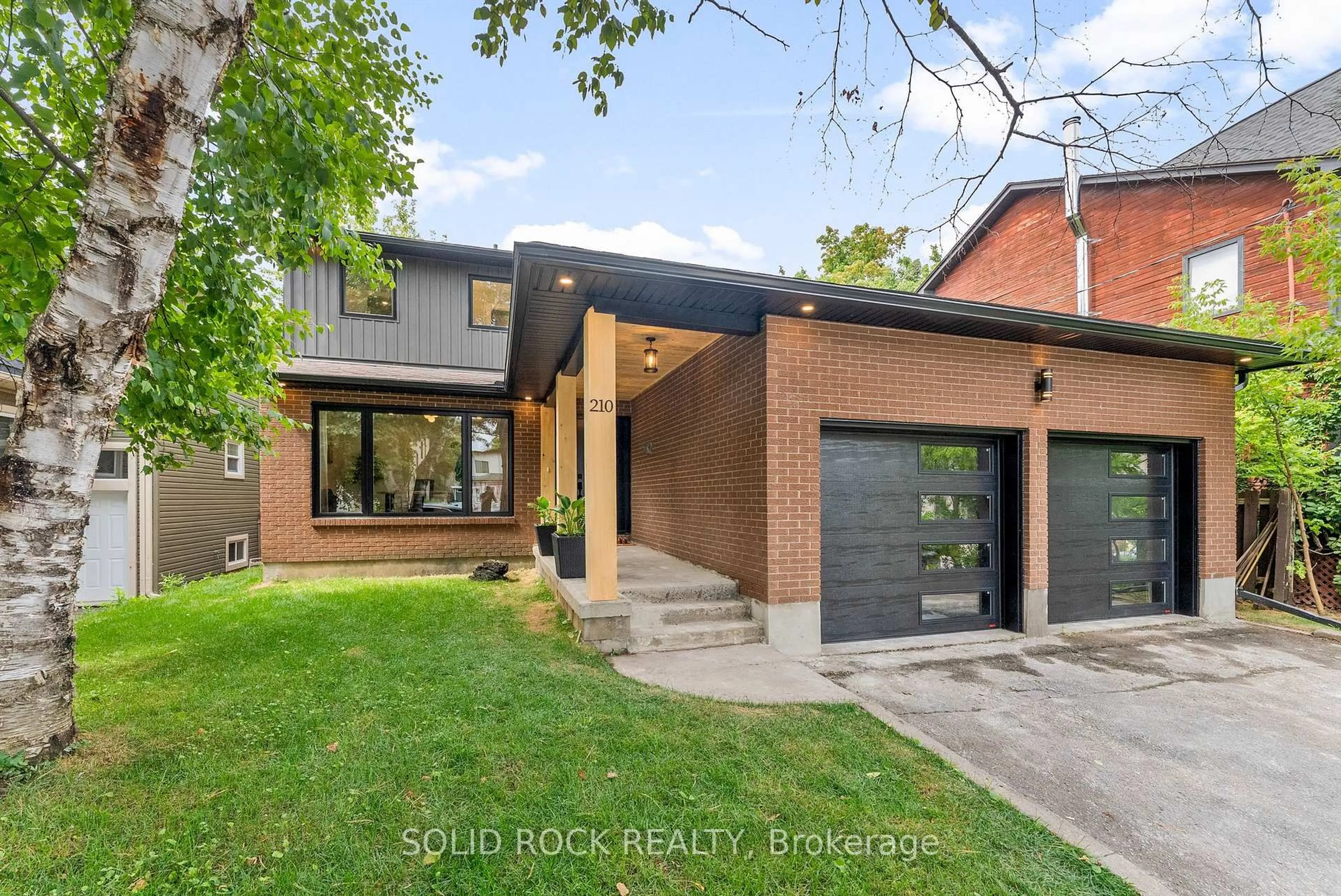 Home with brick exterior material, street for 210 Carleton Ave, Ottawa Ontario K1Y 0J3