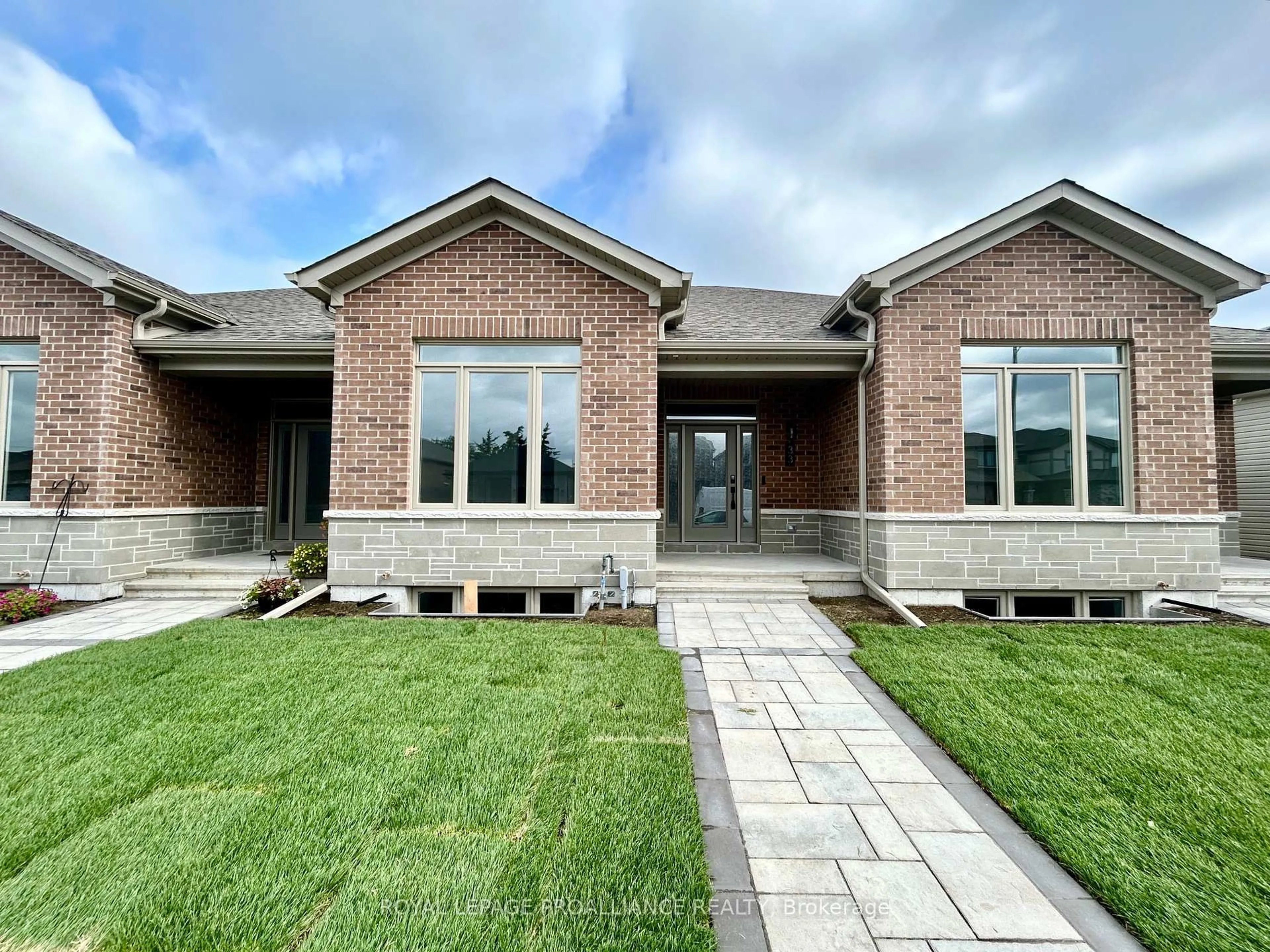Home with brick exterior material, building for 33 Athabaska Dr, Belleville Ontario K8N 0T1