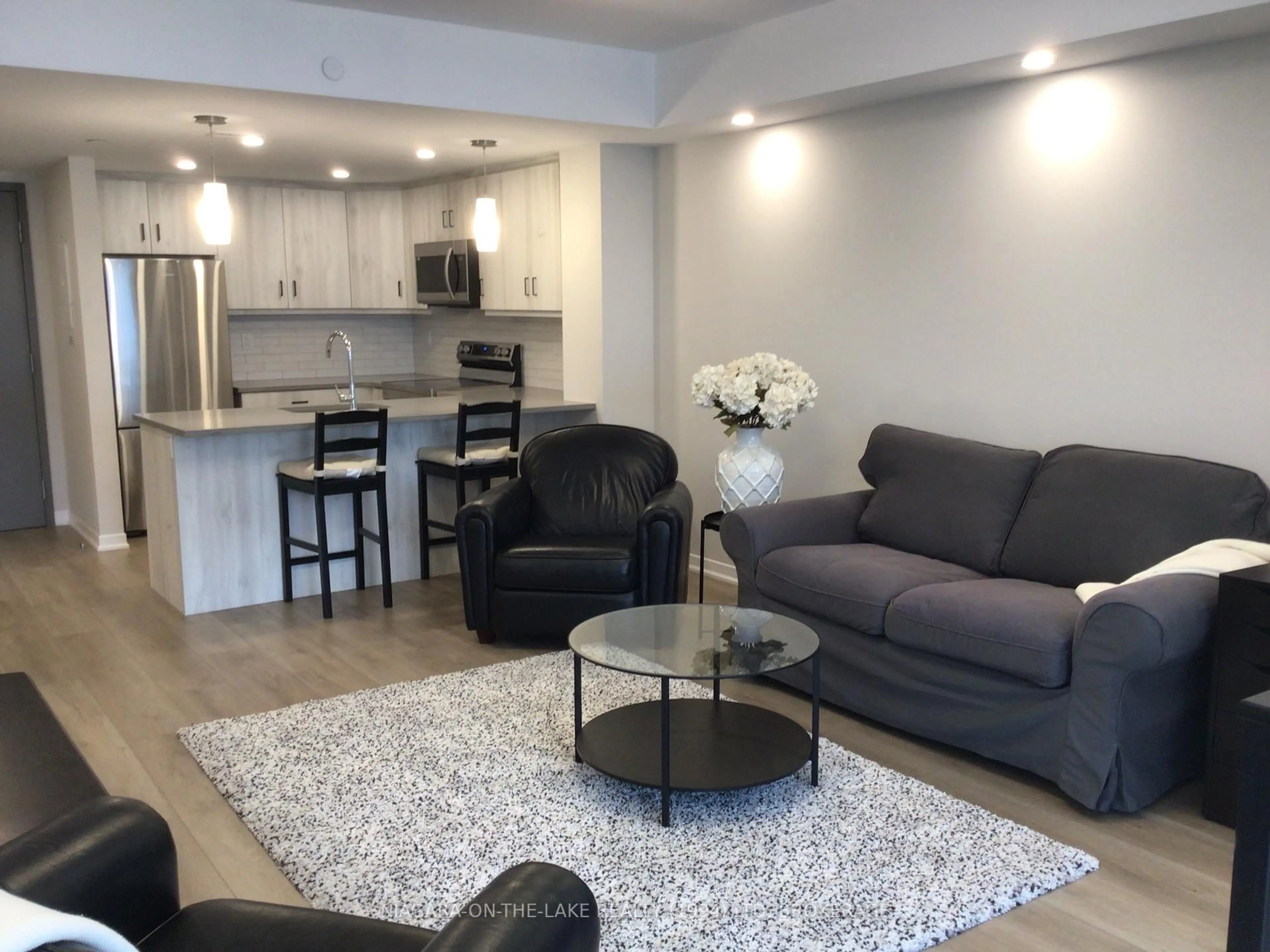 Living room with furniture, unknown for 3998 Victoria Ave #206, Lincoln Ontario L0R 2C0