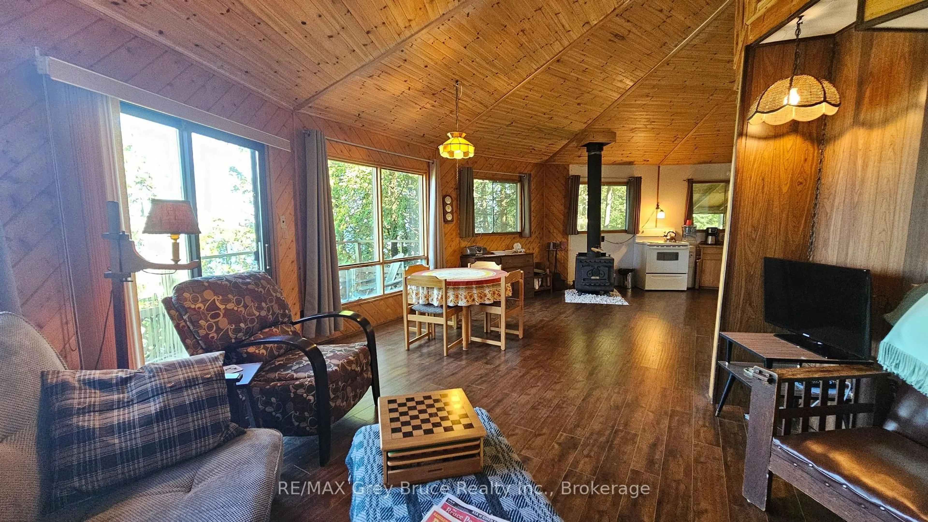 Living room with furniture, wood/laminate floor for 8 CARTER Rd, Northern Bruce Peninsula Ontario N0H 1W0