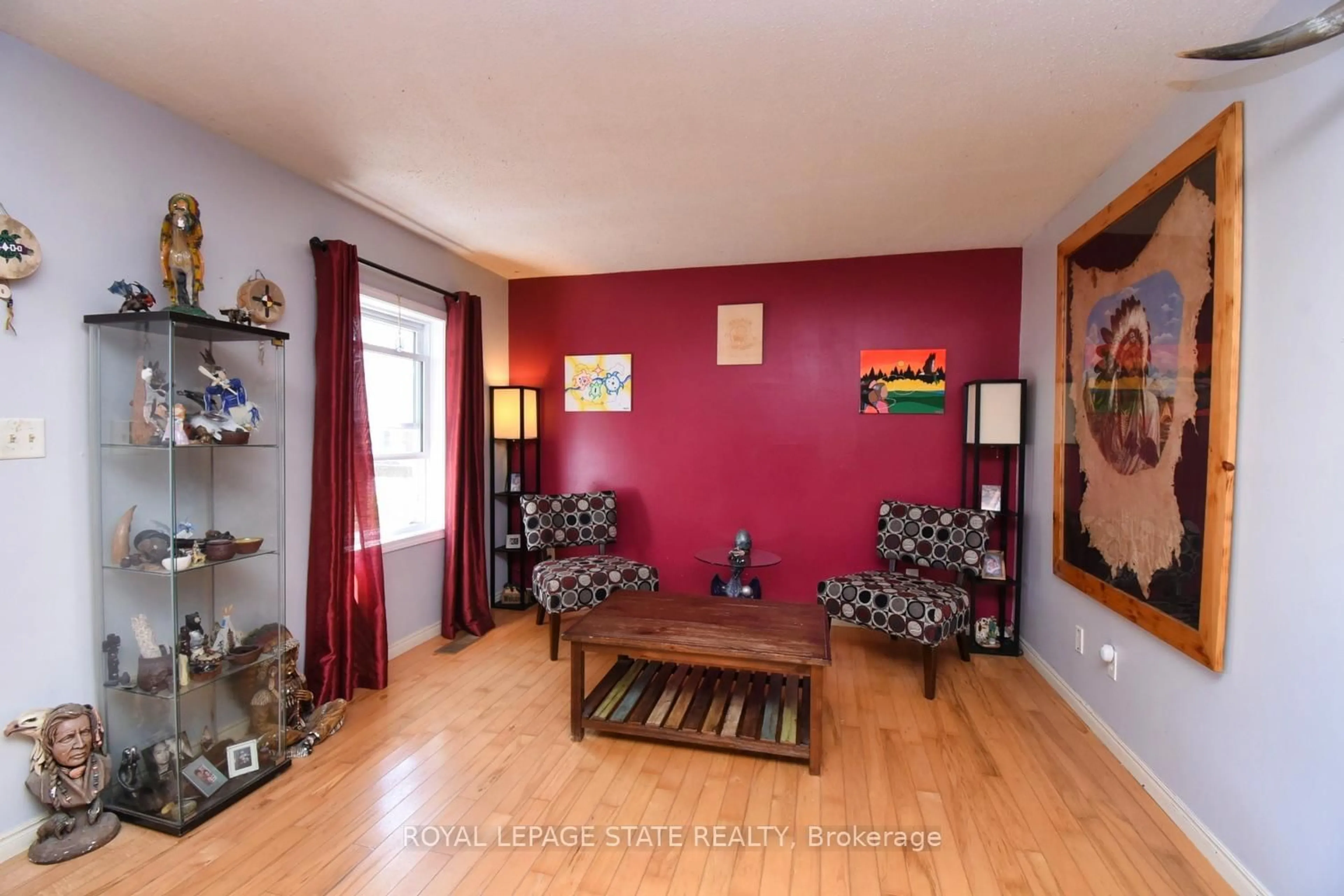 Living room with furniture, wood/laminate floor for 53 Seventh Ave, Brantford Ontario N3S 1B3