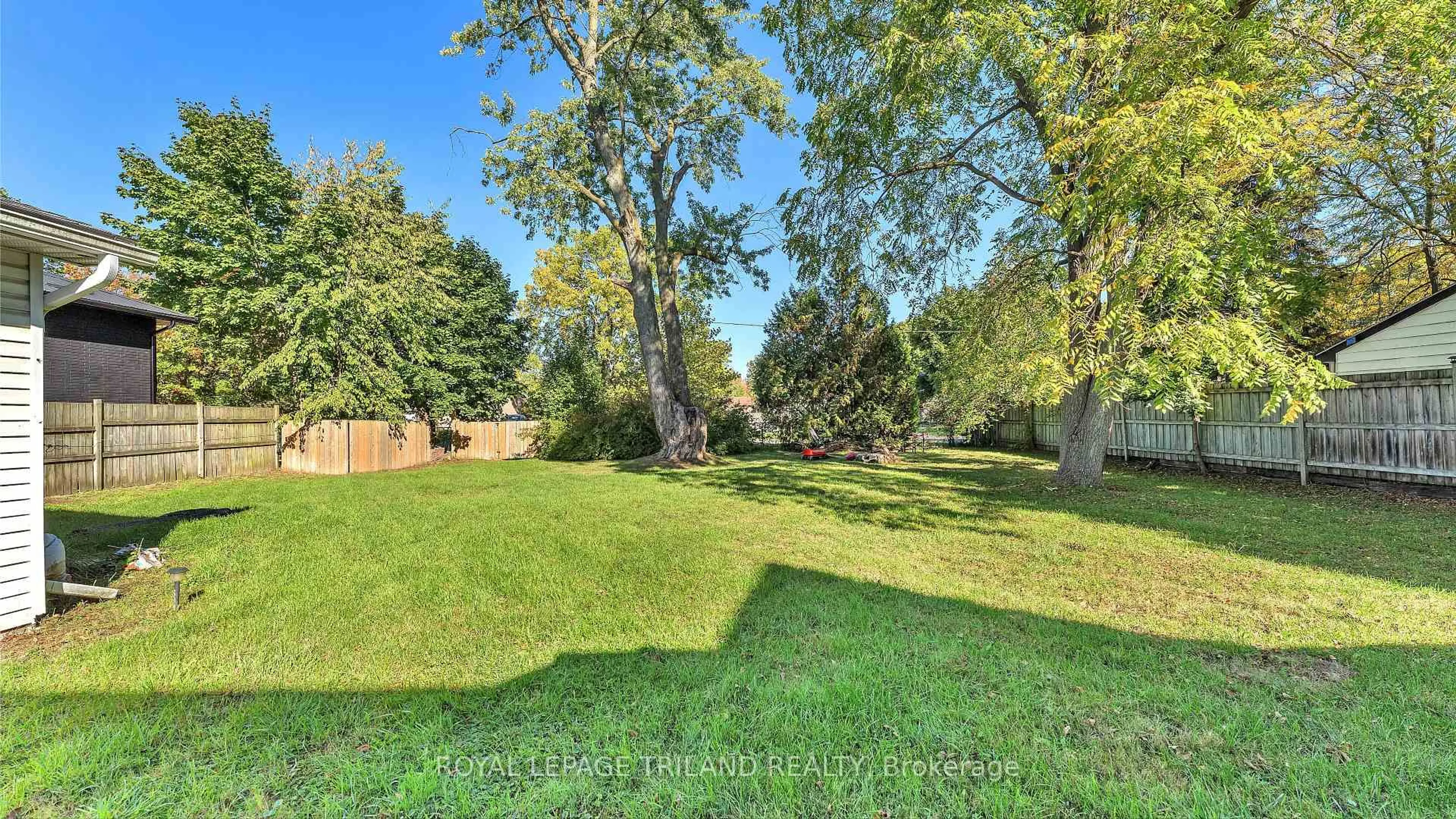 A pic from outside/outdoor area/front of a property/back of a property/a pic from drone, forest/trees view for 1940 Trafalgar St, London East Ontario N5V 1A2