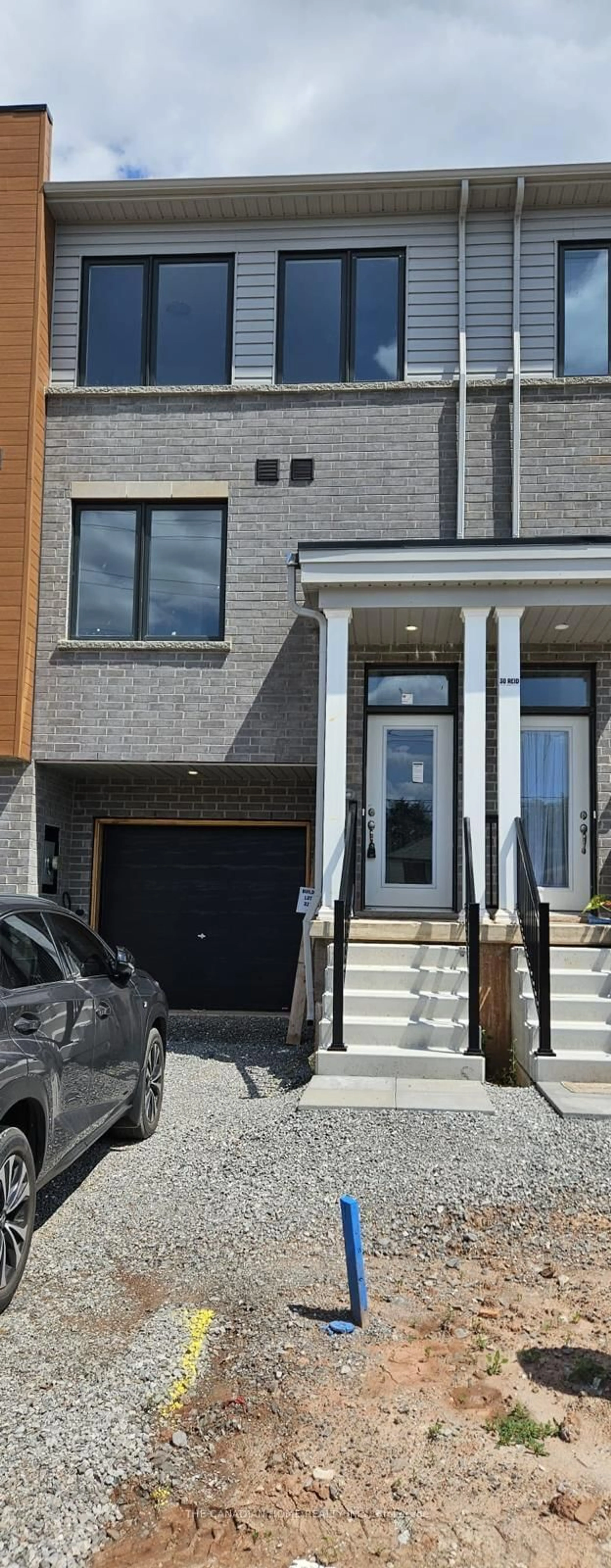 Home with brick exterior material, street for 32 Reid Ave, Hamilton Ontario L8H 0B5