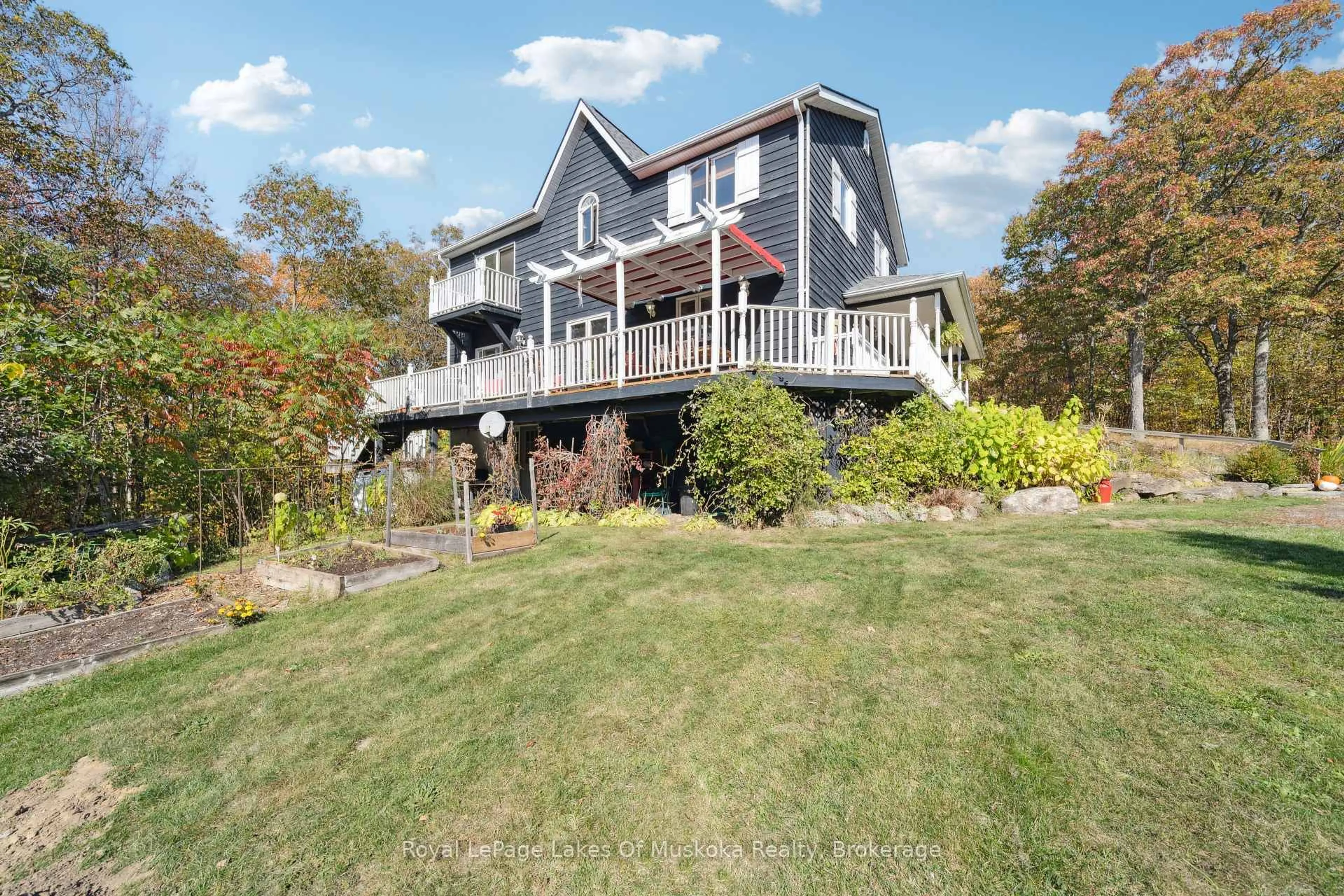 A pic from outside/outdoor area/front of a property/back of a property/a pic from drone, water/lake/river/ocean view for 1779 Muskoka Rd 118 Rd, Muskoka Lakes Ontario P1L 1W8