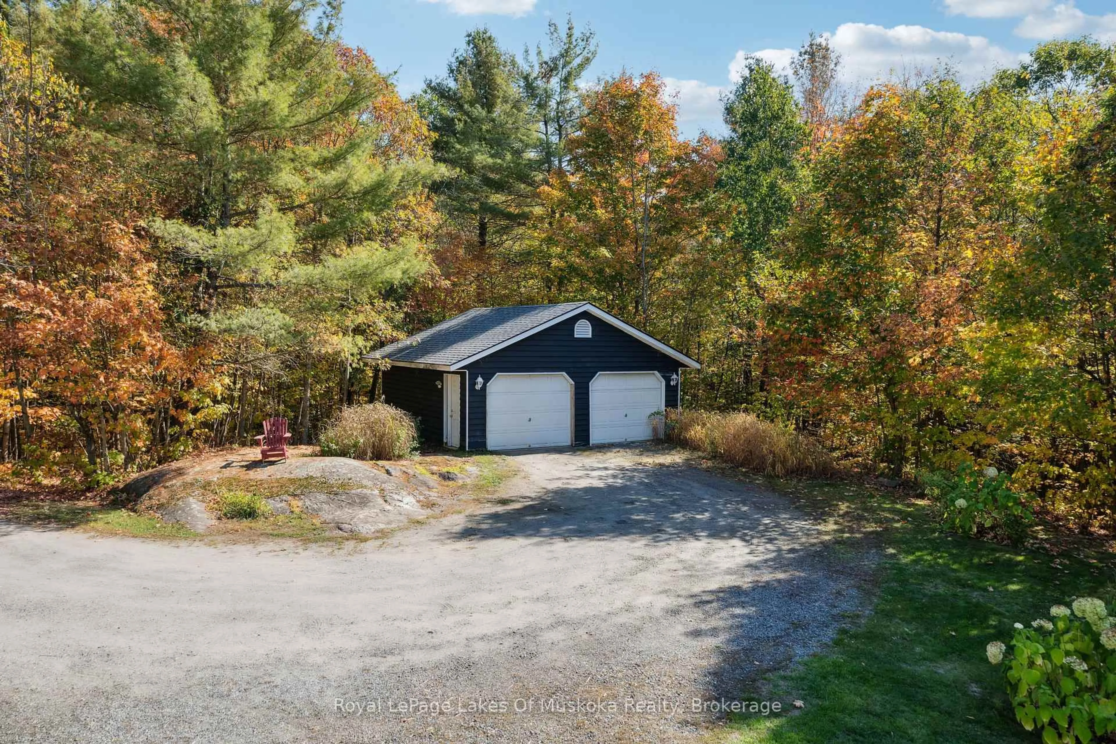 A pic from outside/outdoor area/front of a property/back of a property/a pic from drone, forest/trees view for 1779 Muskoka Rd 118 Rd, Muskoka Lakes Ontario P1L 1W8