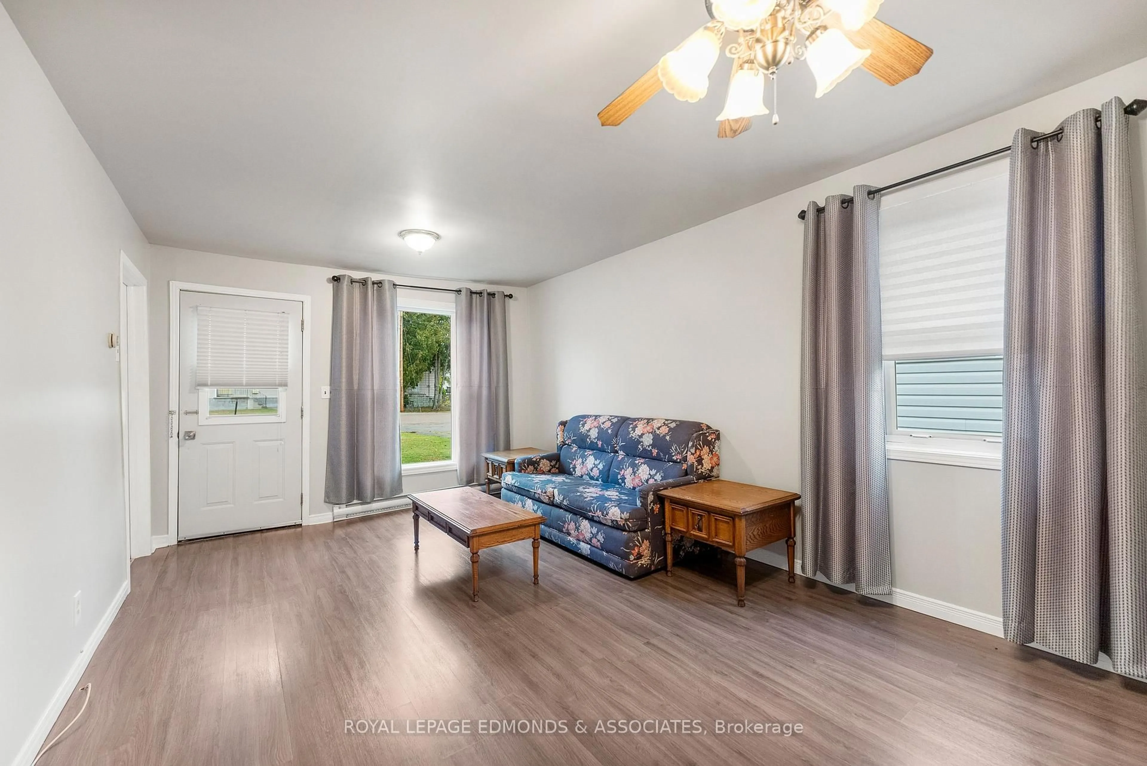 Living room with furniture, wood/laminate floor for 1024 Poirier St, Pembroke Ontario K8A 6H2