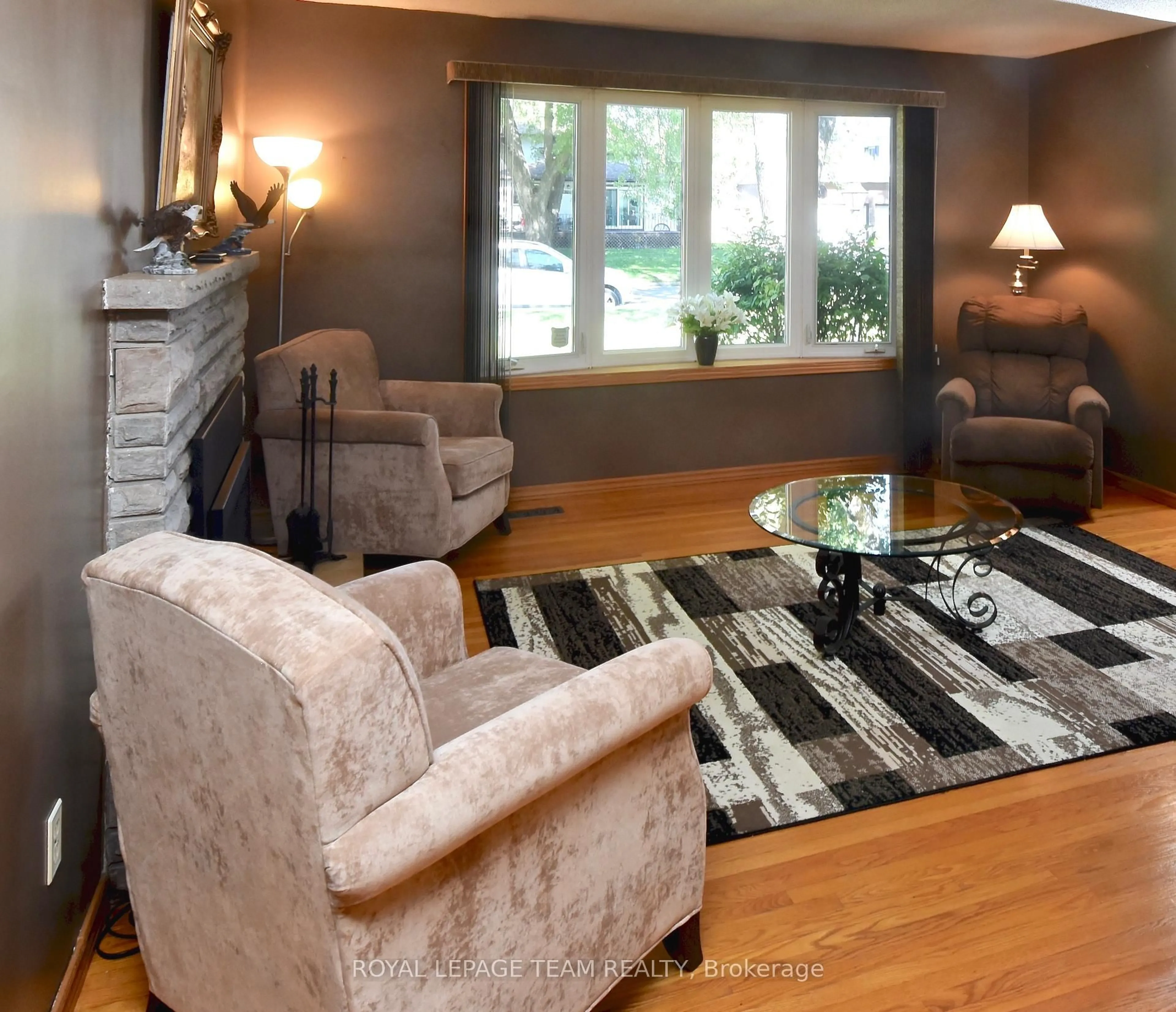 Living room with furniture, wood/laminate floor for 28 Peden Blvd, Brockville Ontario K6V 3K3