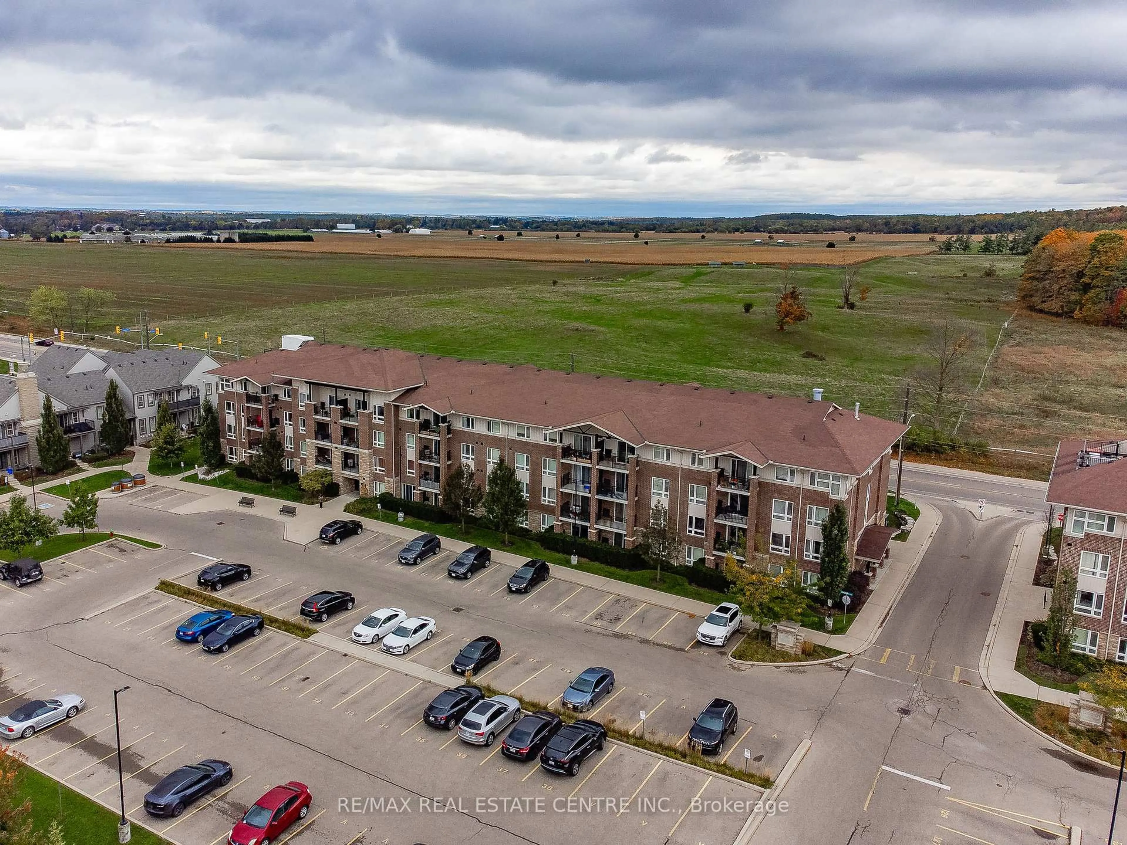 A pic from outside/outdoor area/front of a property/back of a property/a pic from drone, unknown for 67 Kingsbury Sq #411, Guelph Ontario N1L 0L3