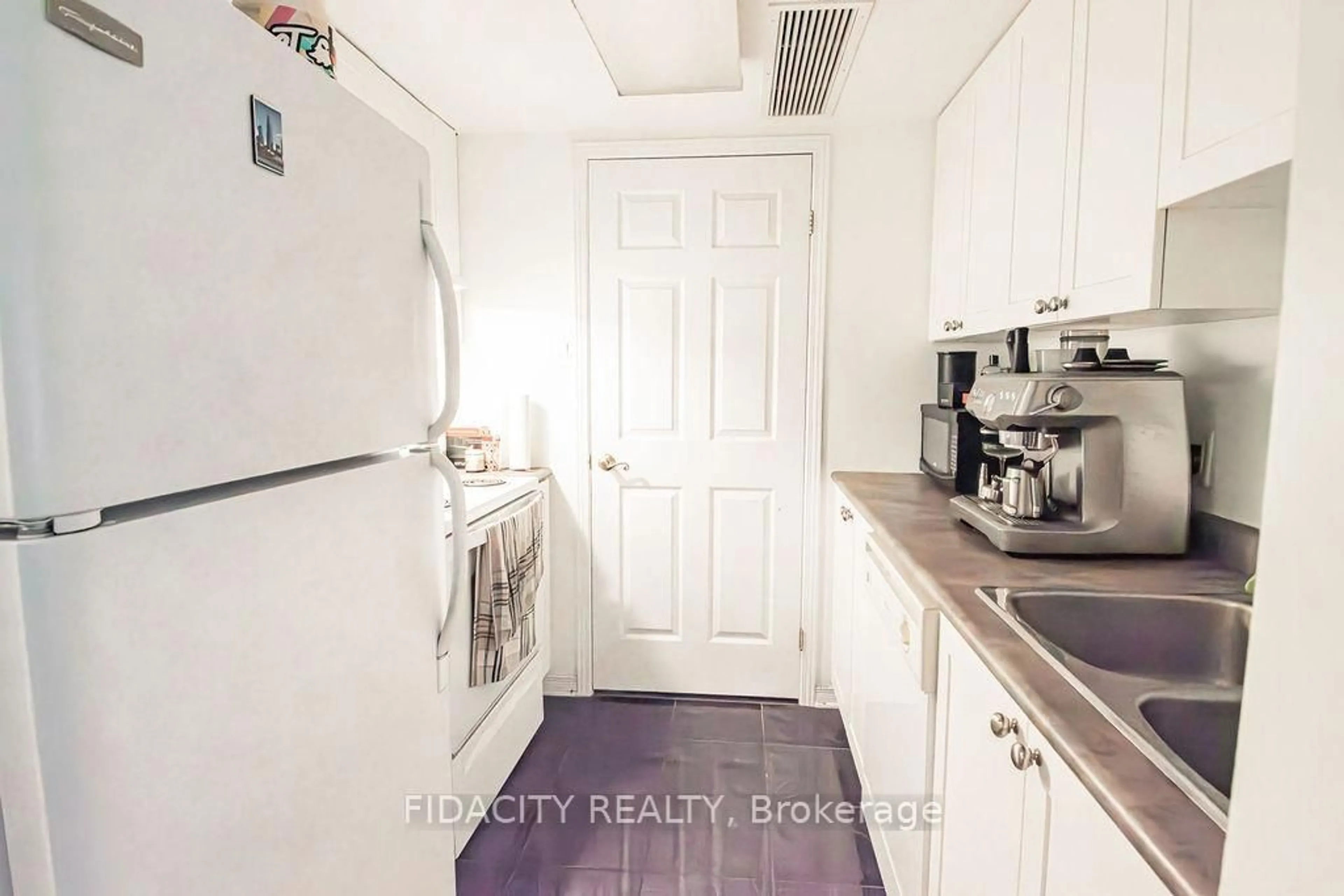 Kitchen with laundary machines, unknown for 310 Central Park Dr #5C, Ottawa Ontario K2C 4G4