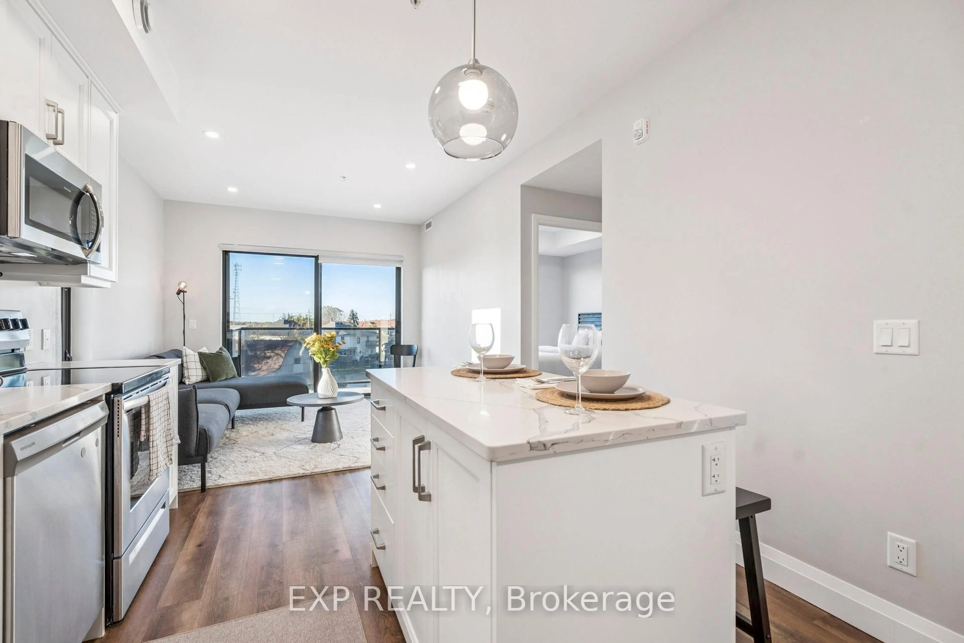 Open concept kitchen, wood/laminate floor for 64 Main St #316, Haldimand Ontario N0A 1H0
