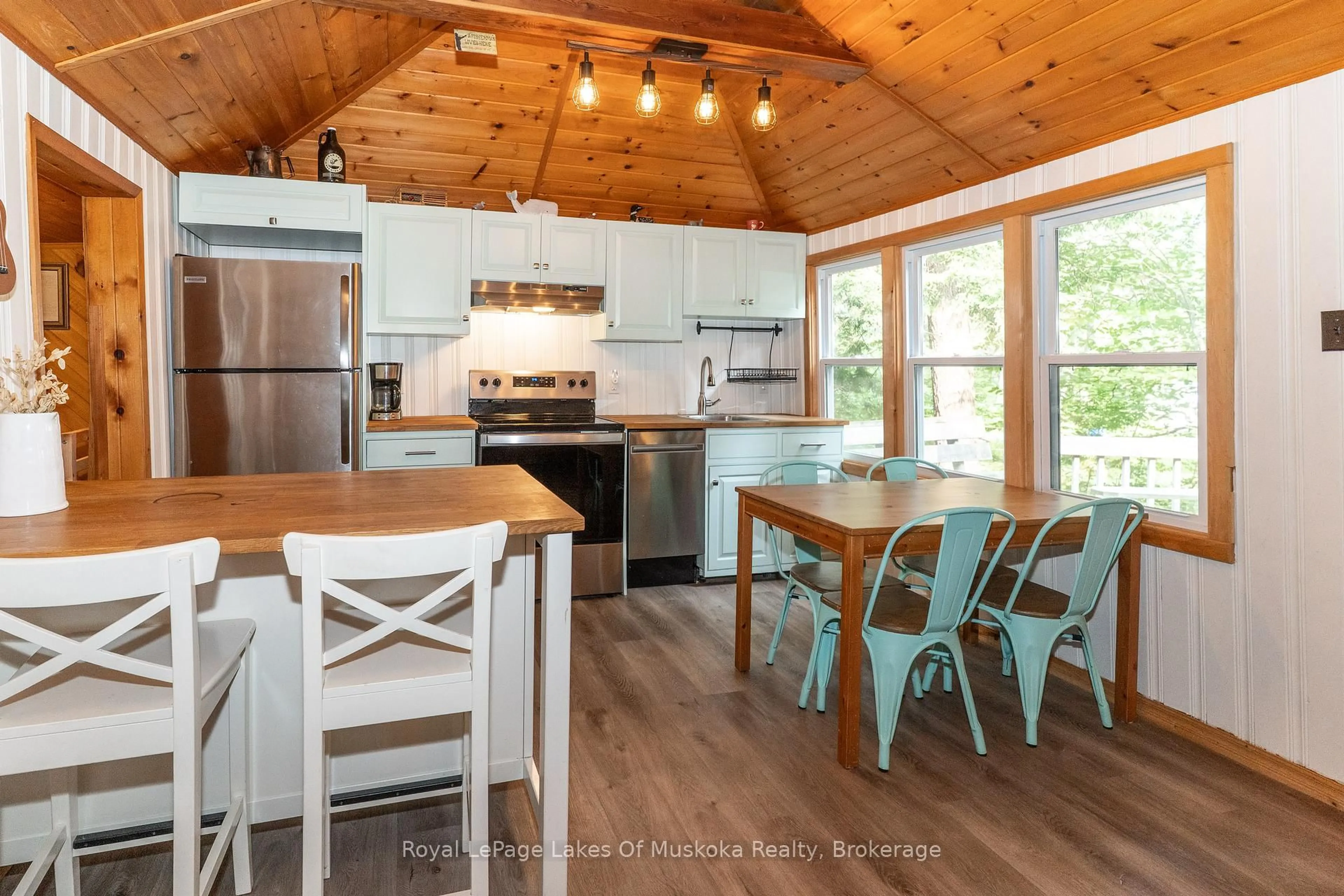 Open concept kitchen, wood/laminate floor for 1072 Long Lake Rd, Muskoka Lakes Ontario P0C 1A0