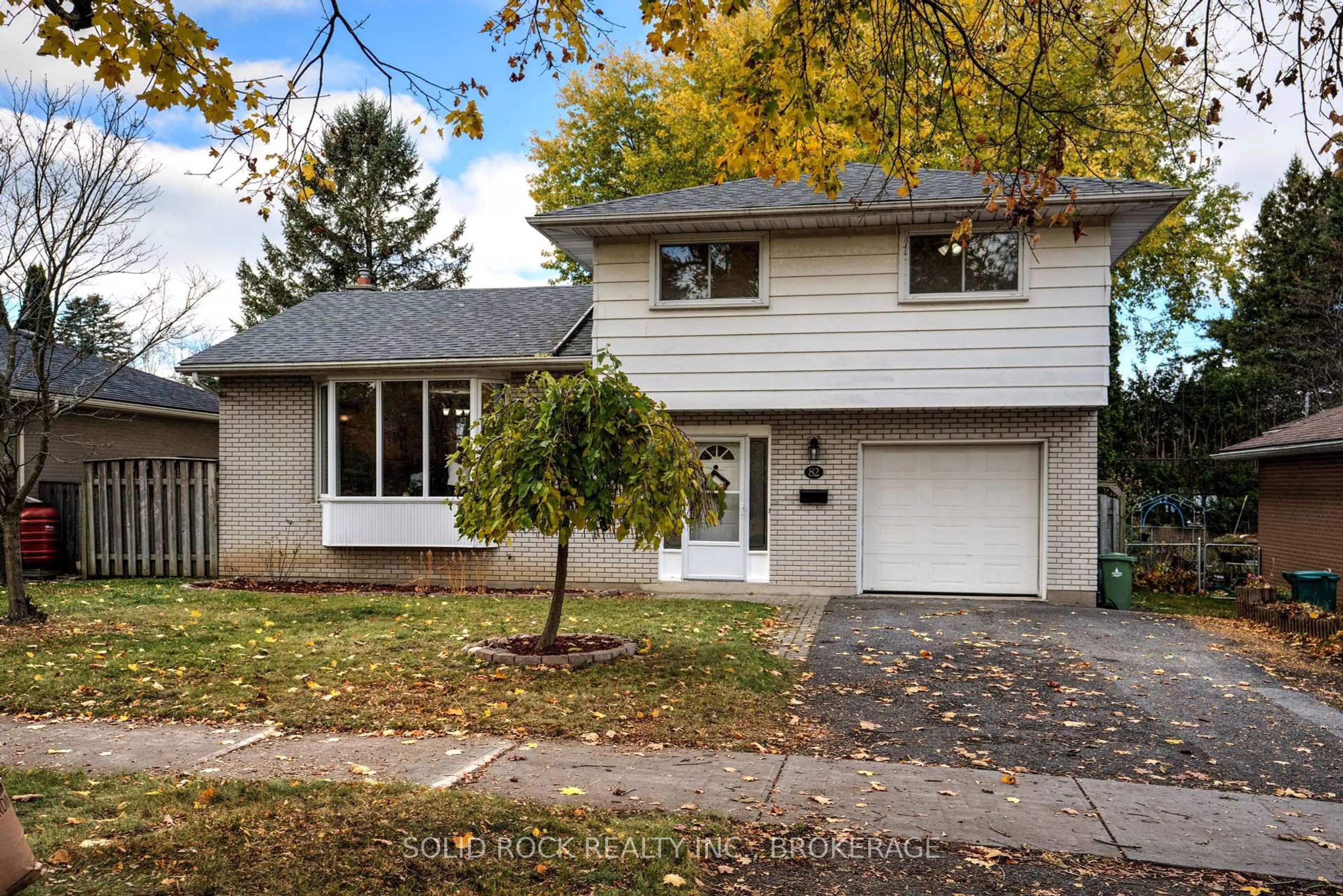 Home with vinyl exterior material, street for 82 Queen Mary Rd, Kingston Ontario K7M 2A5
