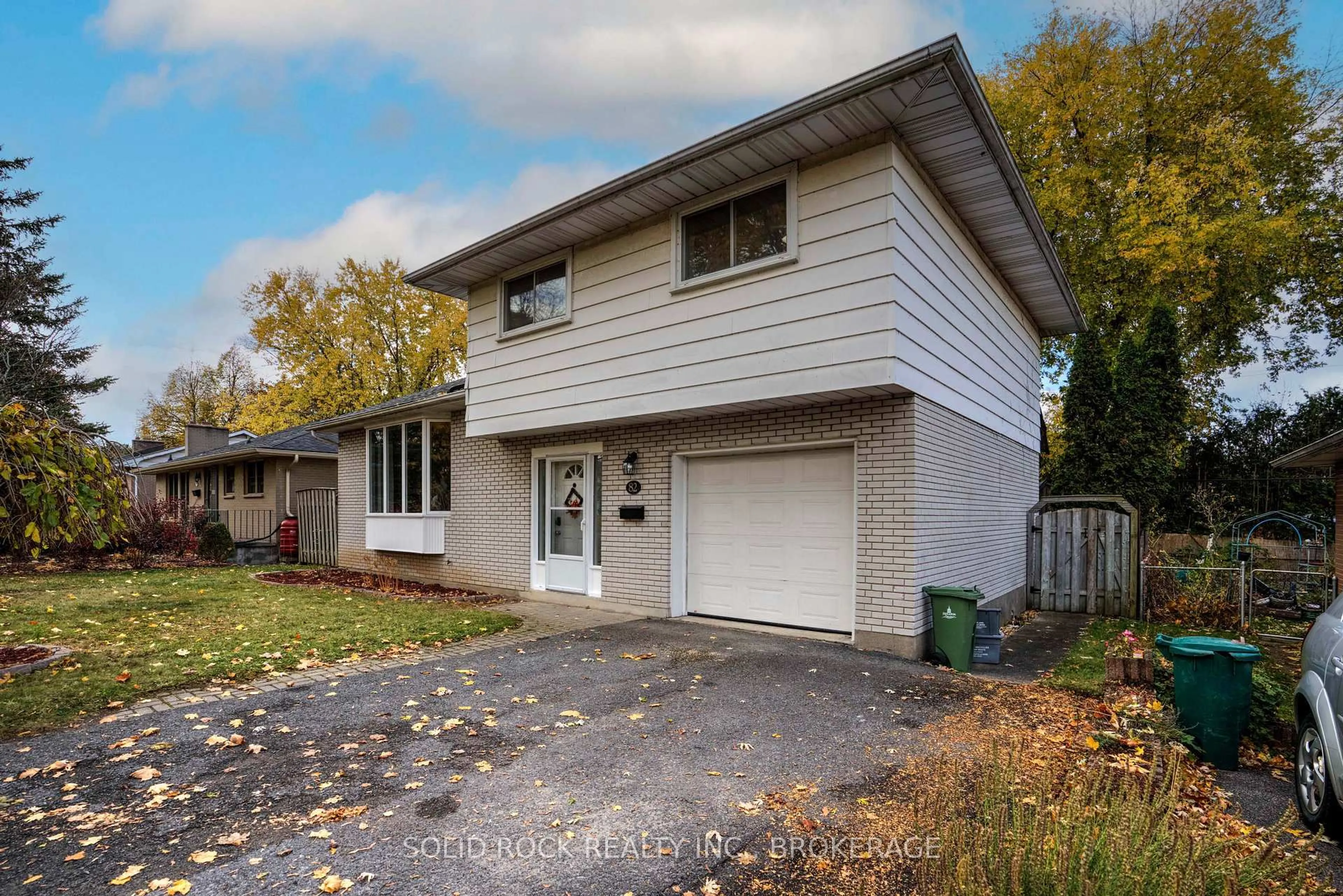 Home with vinyl exterior material, street for 82 Queen Mary Rd, Kingston Ontario K7M 2A5