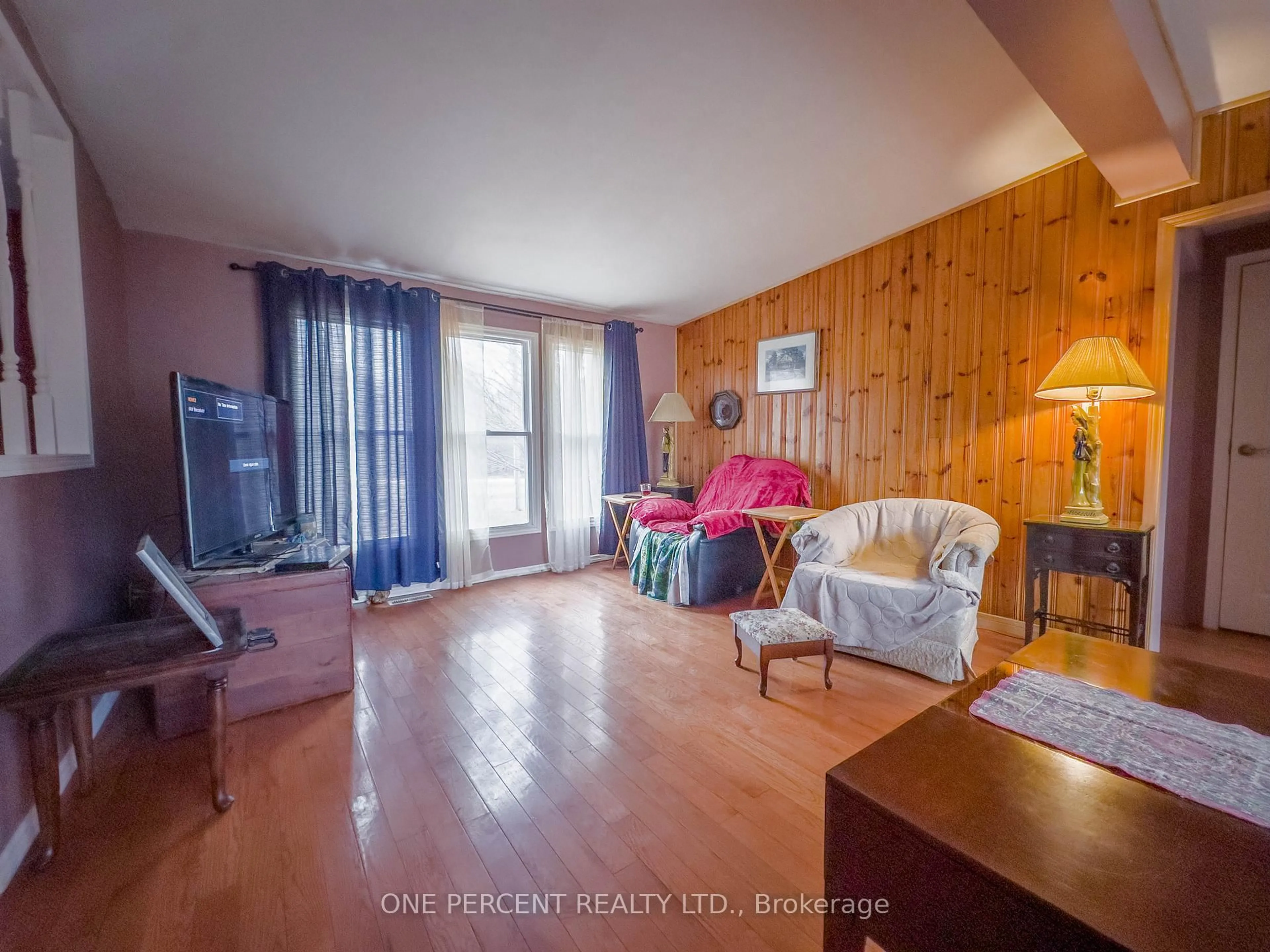 Living room with furniture, wood/laminate floor for 19656 Loyalist Pkwy, Prince Edward County Ontario K0K 1T0