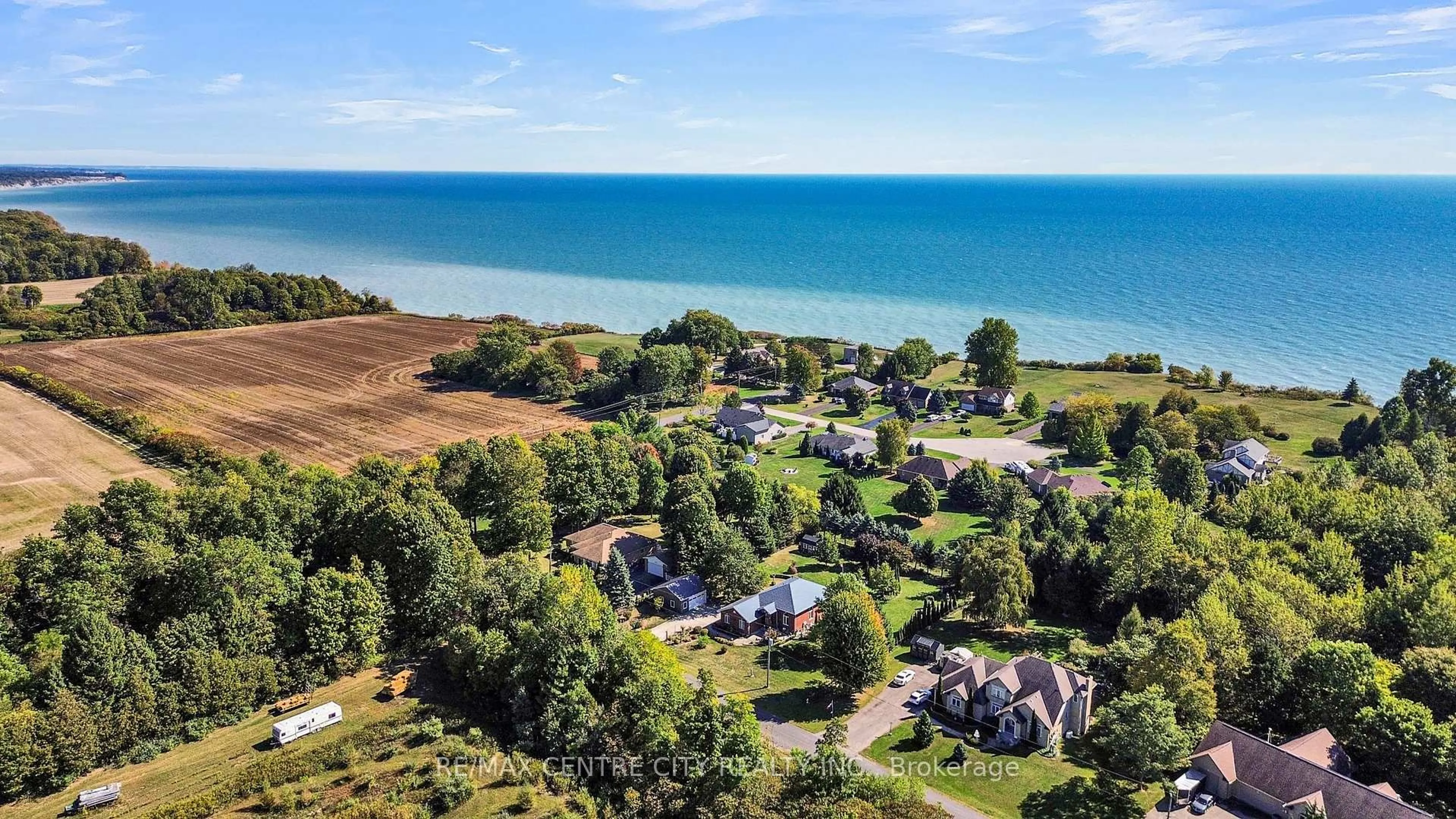 A pic from outside/outdoor area/front of a property/back of a property/a pic from drone, water/lake/river/ocean view for 25181 Gray Line, West Elgin Ontario N0L 2P0