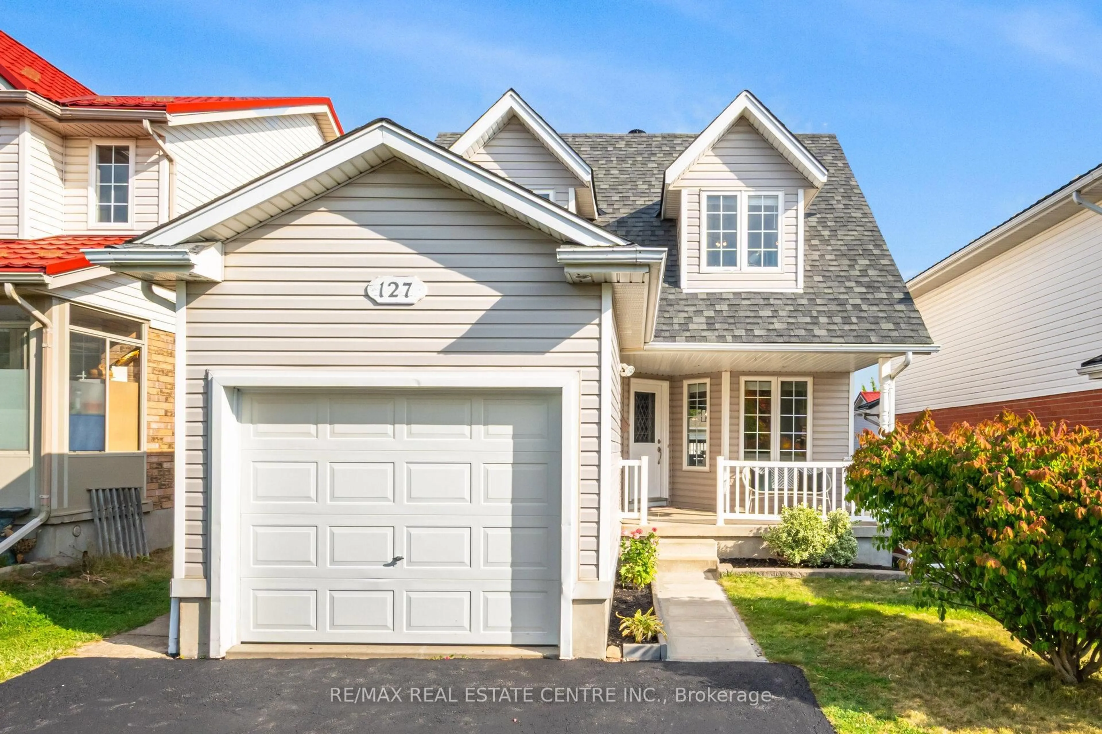 Home with vinyl exterior material, street for 127 Silurian Dr, Guelph Ontario N1E 7G2