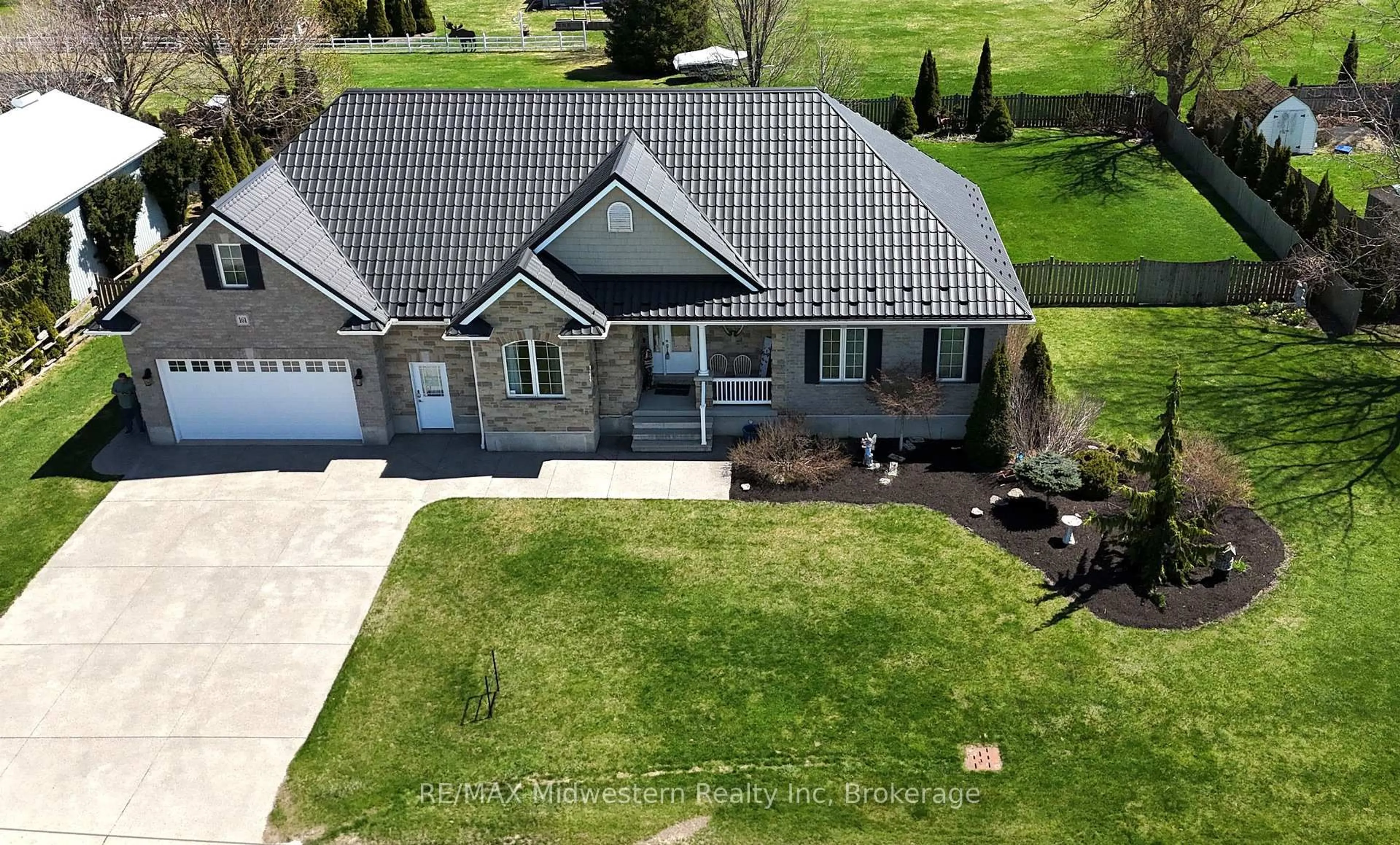 A pic from outside/outdoor area/front of a property/back of a property/a pic from drone, street for 161 Brock St, West Perth Ontario N0K 1P0
