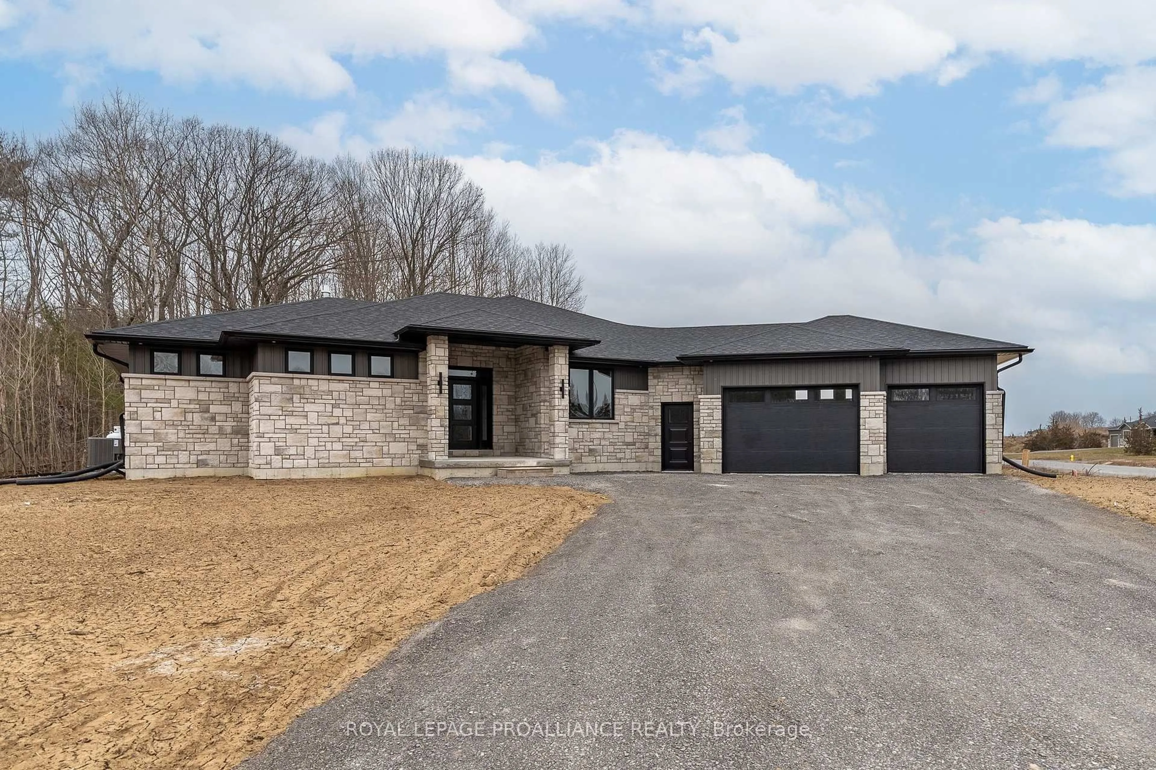 Home with brick exterior material, street for 235 Michael's Way, Prince Edward County Ontario K0K 1L0