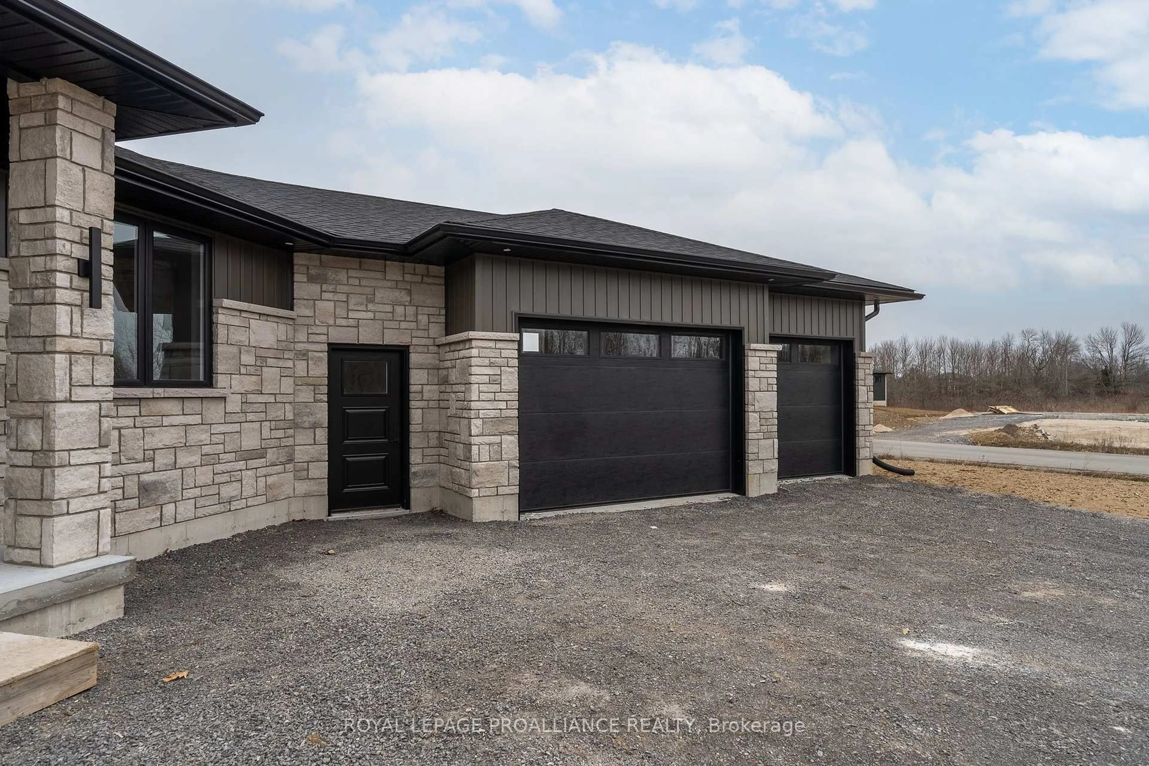 Home with brick exterior material, street for 235 Michael's Way, Prince Edward County Ontario K0K 1L0