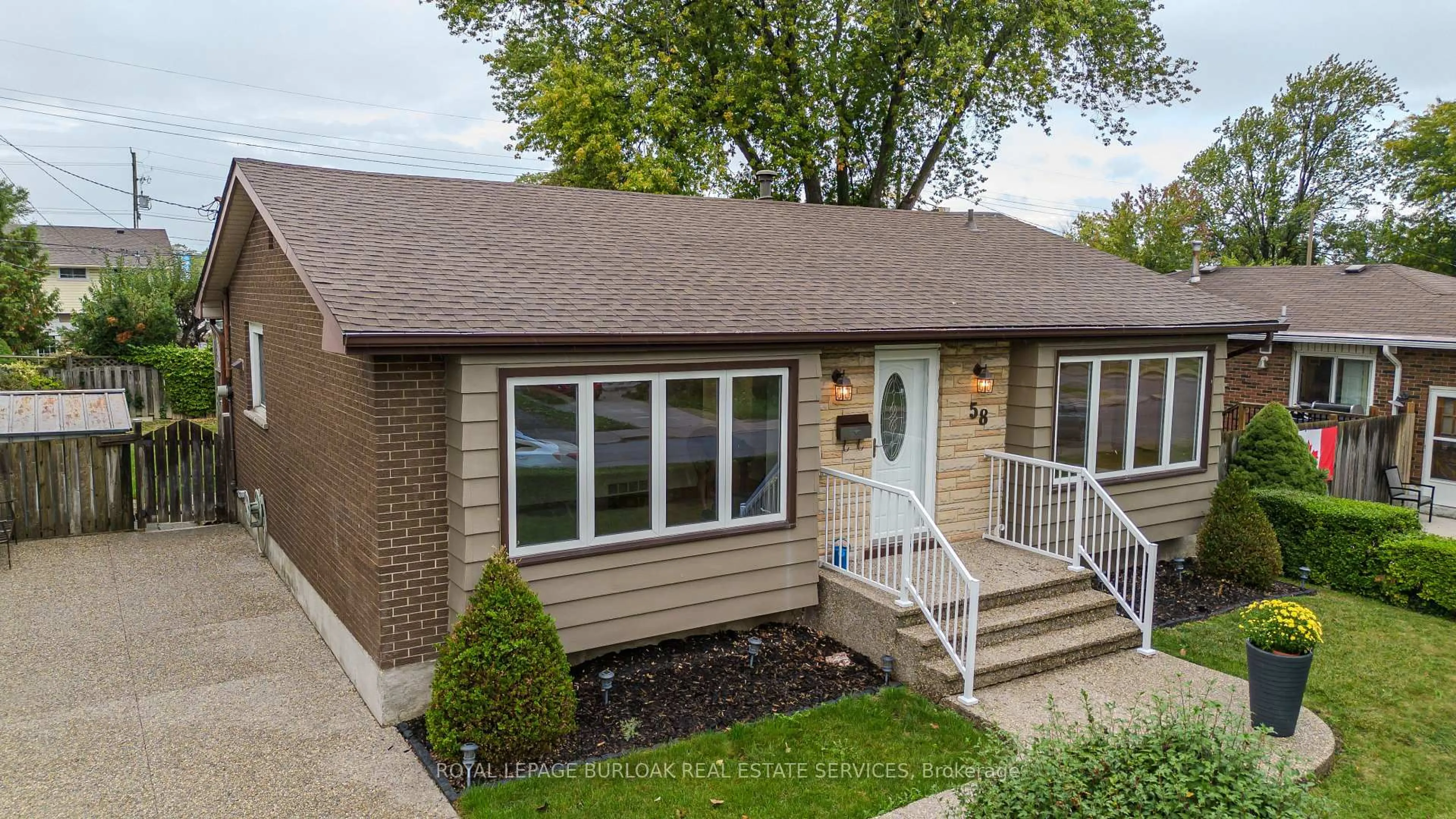 Home with brick exterior material, street for 58 Goldfinch Rd, Hamilton Ontario L9A 3W7