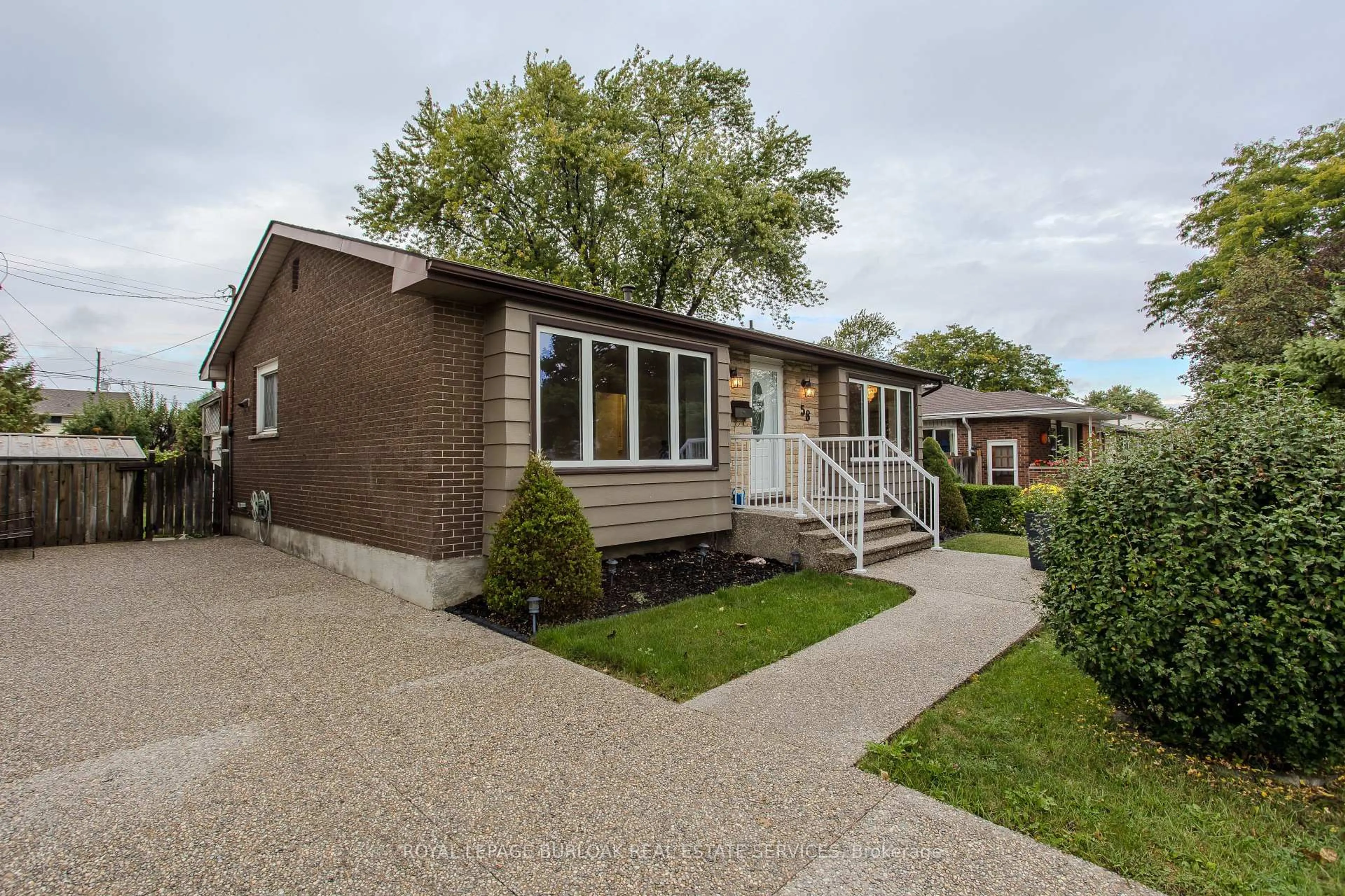 Home with brick exterior material, street for 58 Goldfinch Rd, Hamilton Ontario L9A 3W7