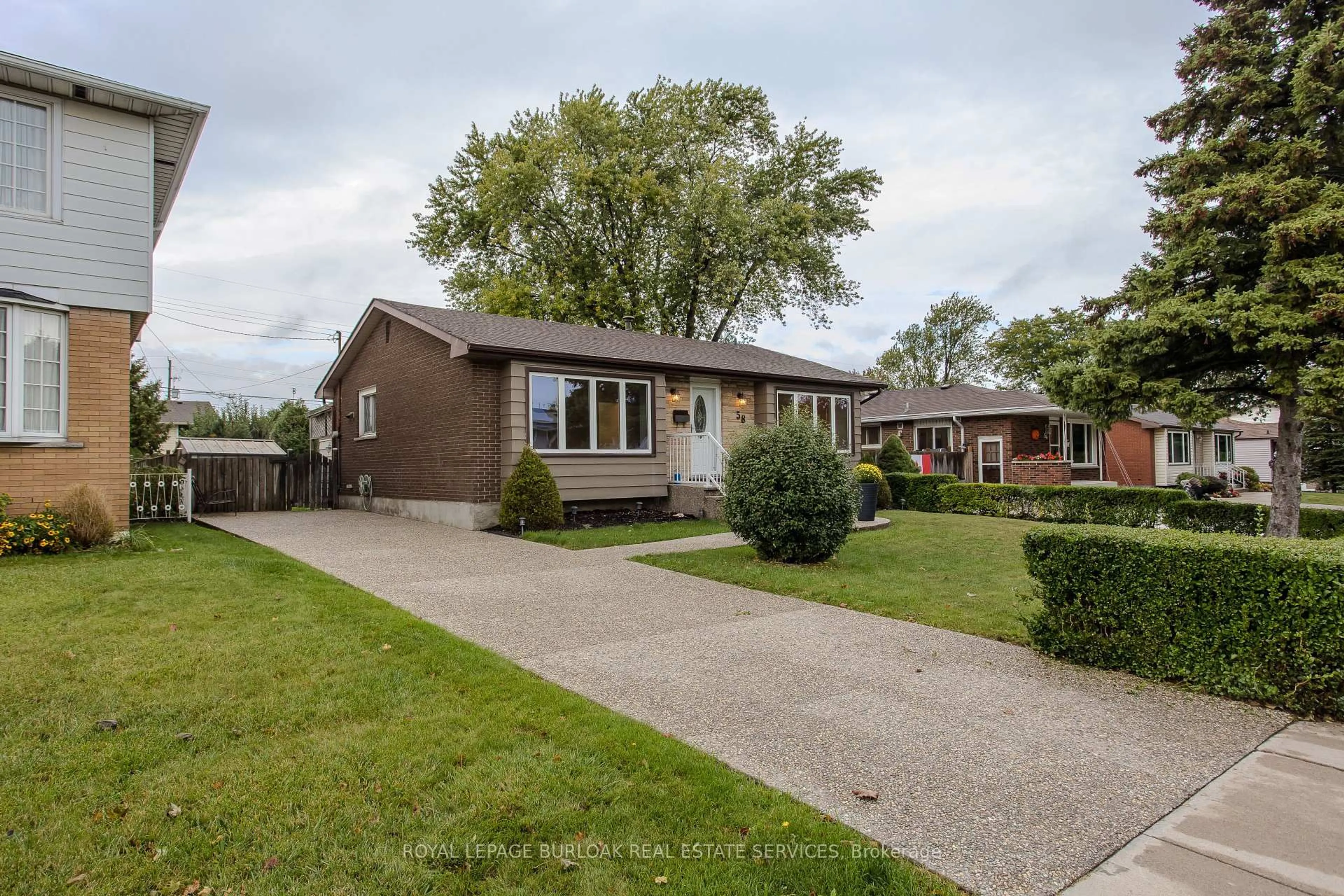 Home with brick exterior material, street for 58 Goldfinch Rd, Hamilton Ontario L9A 3W7